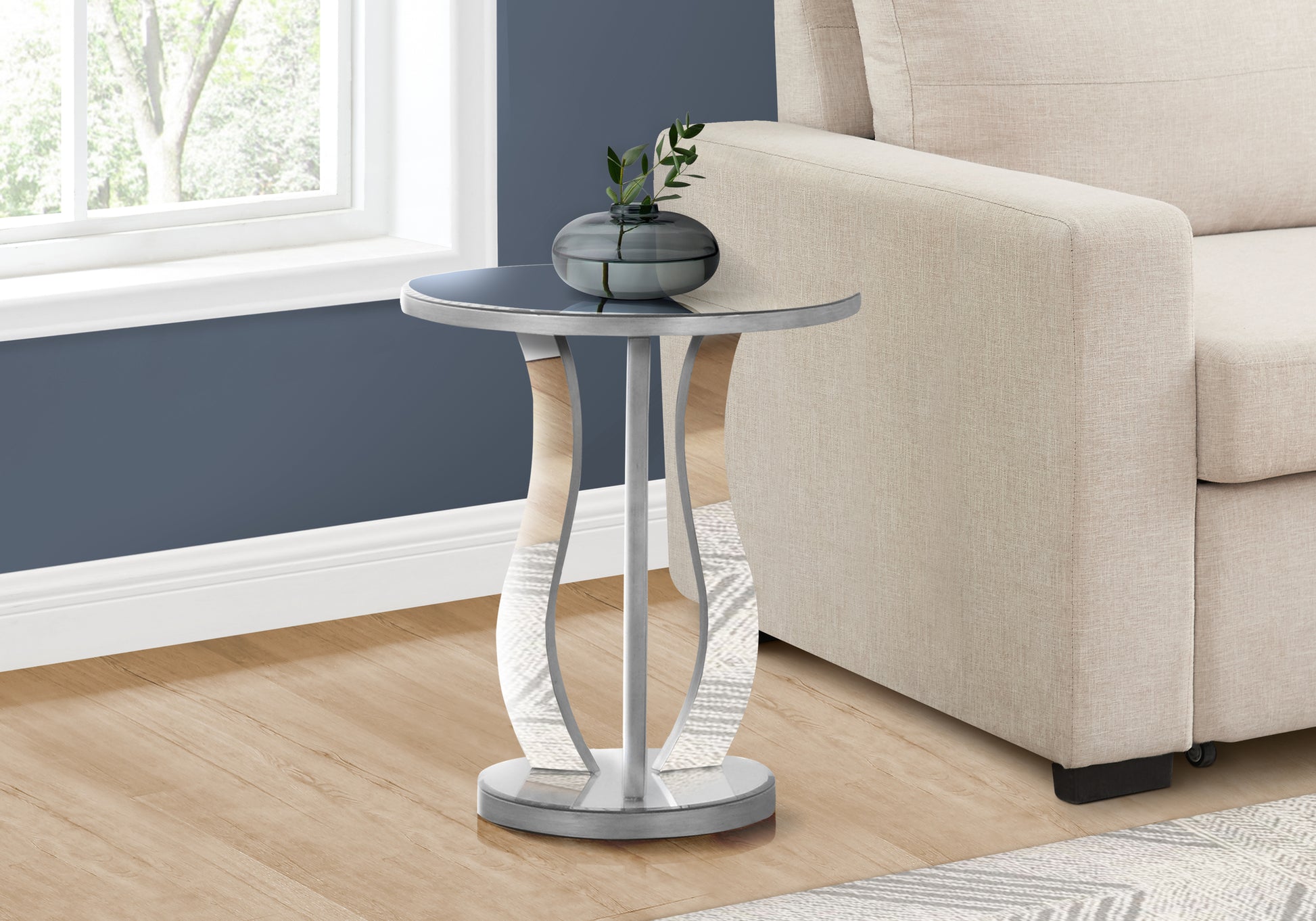 Modern silver accent table with curved wood and mirrored pedestal base