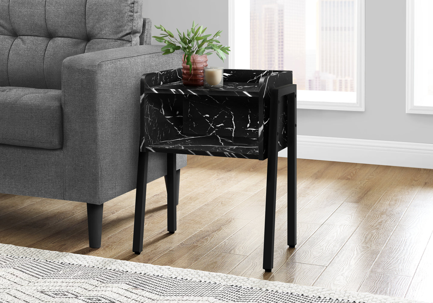 Black marble end table with gold accents and modern design