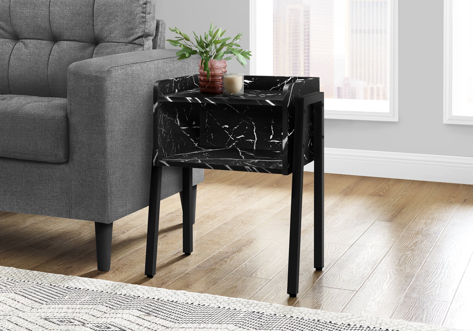 Black marble end table with gold accents and modern design