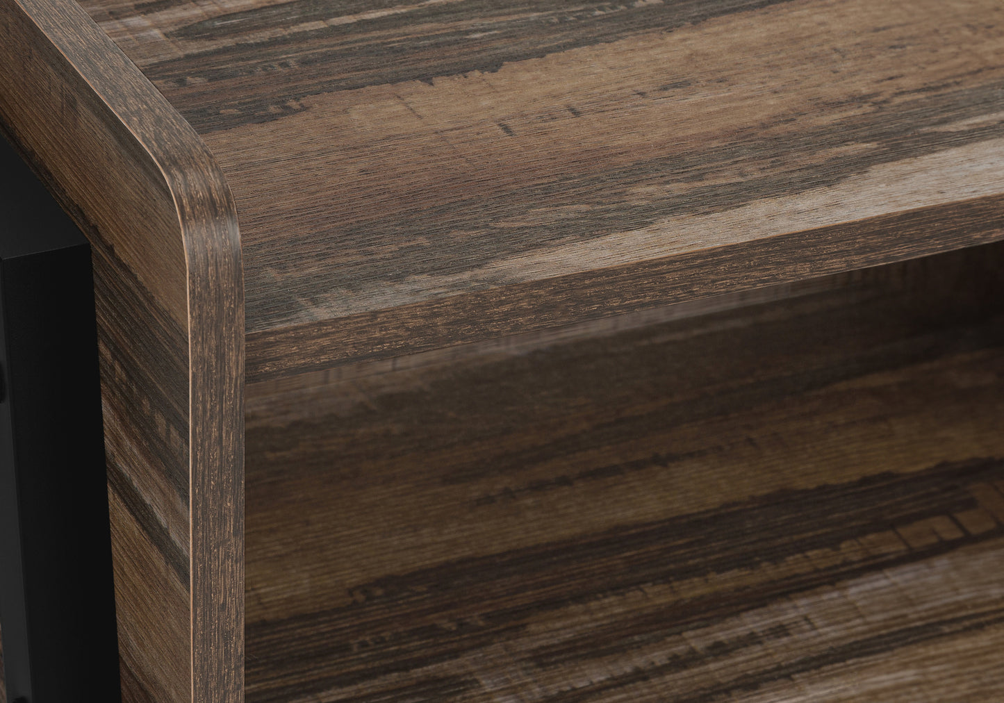 Closeup of distressed wood veneer shelf with dark grain pattern