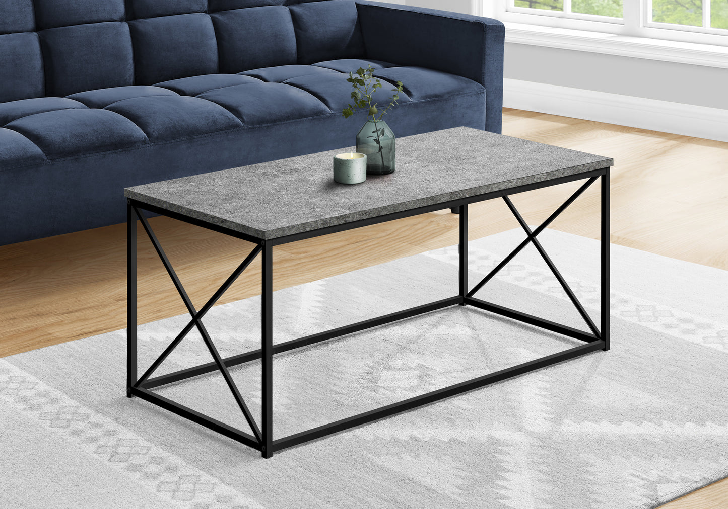 Modern rectangular coffee table with gray stoneeffect top and black metal base