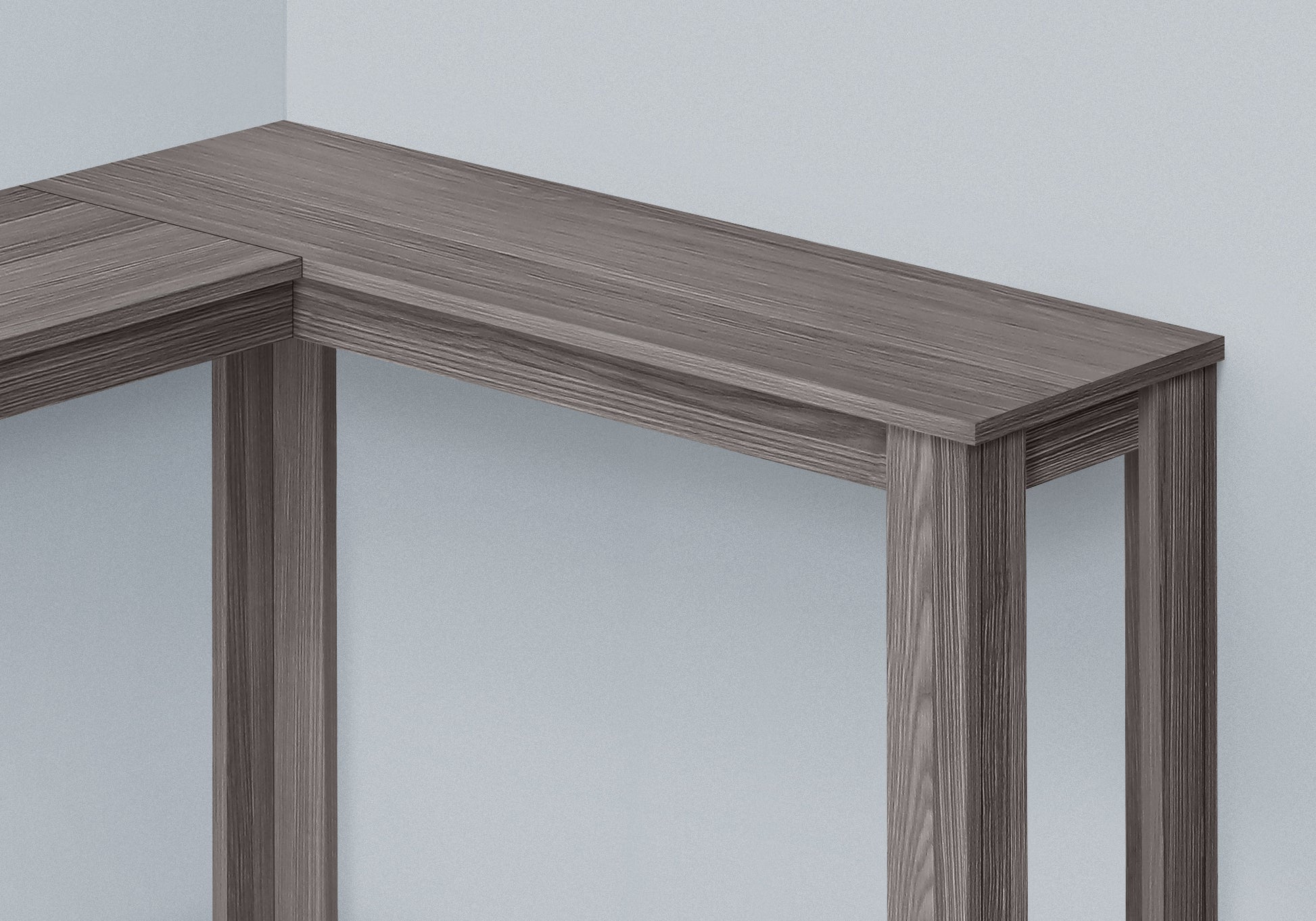 Modern grey wood corner desk with a minimalist design perfect for home offices