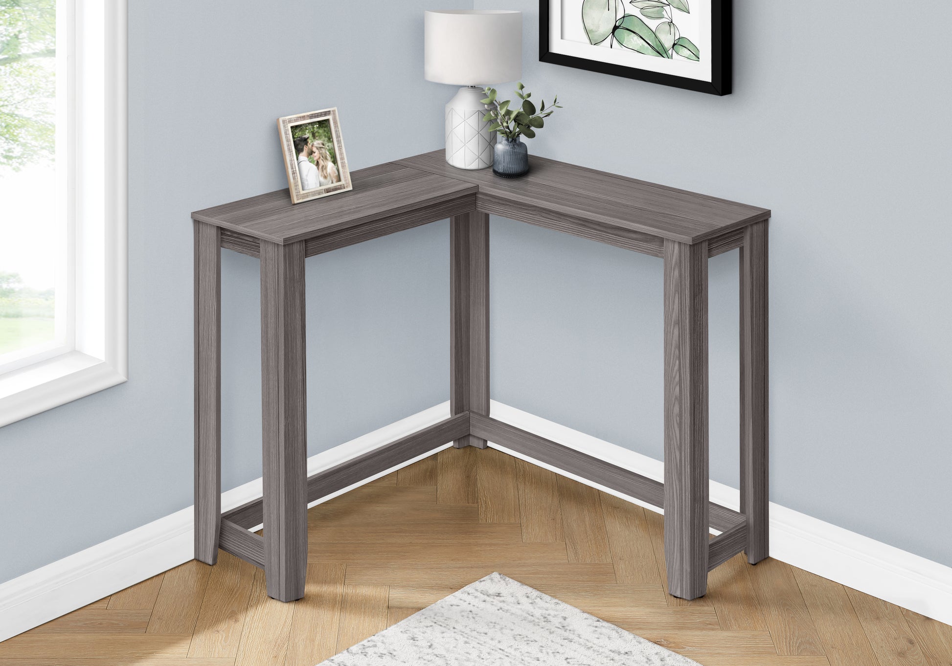 Gray corner desk with a modern minimalist design perfect for small spaces