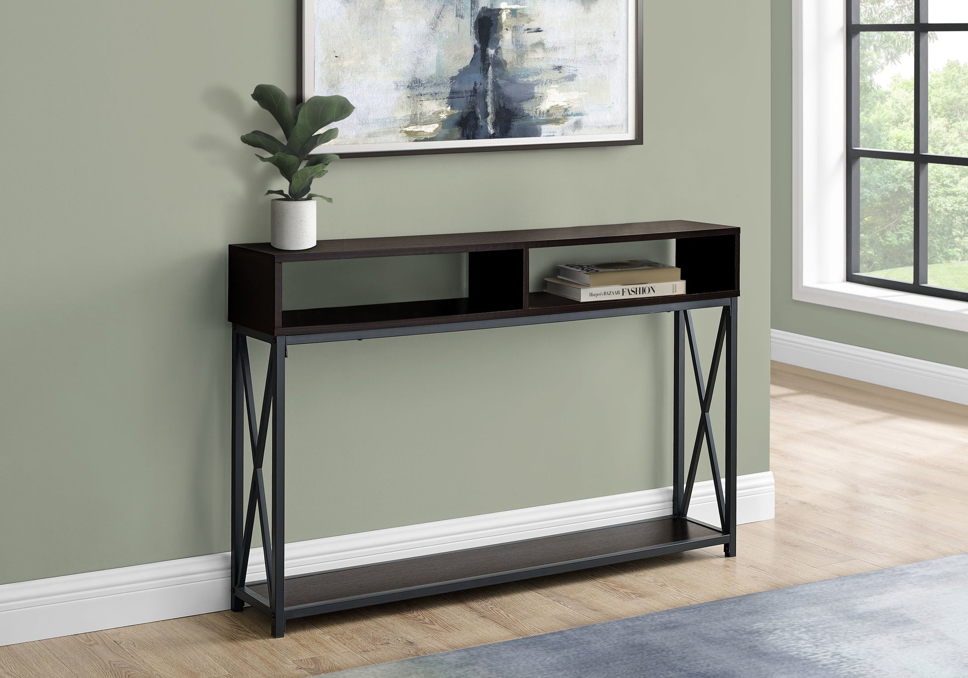 Dark brown console table with black metal legs and open shelving displaying books