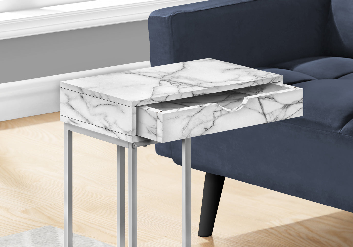 Modern marble end table with one open drawer on a silver metal frame