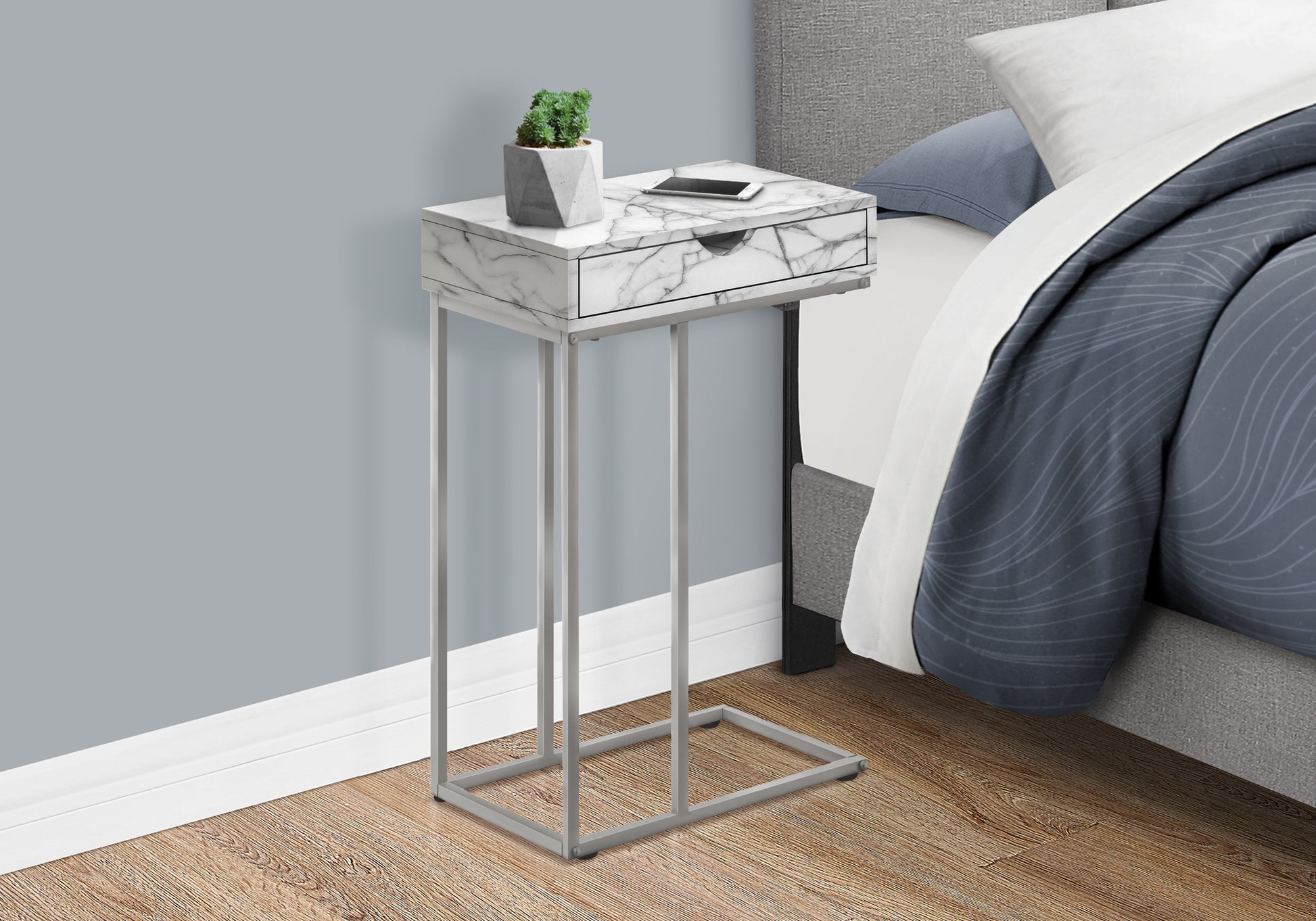 Modern Ctable with marblelook top and silver metal frame perfect for bedside use