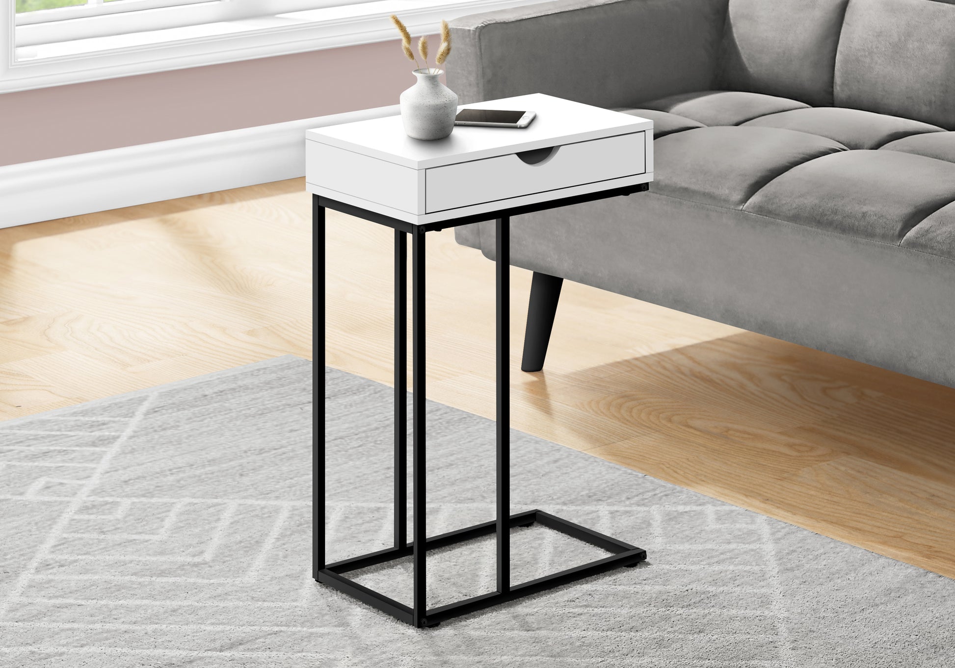 White ctable with black metal frame single drawer and modern design beside gray sofa