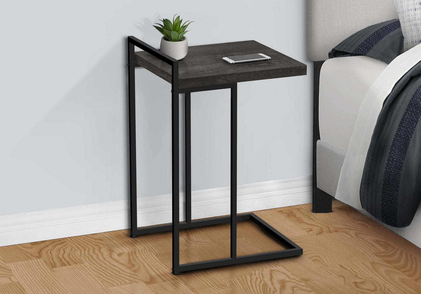 Dark wood ctable with black metal frame perfect for bedside use