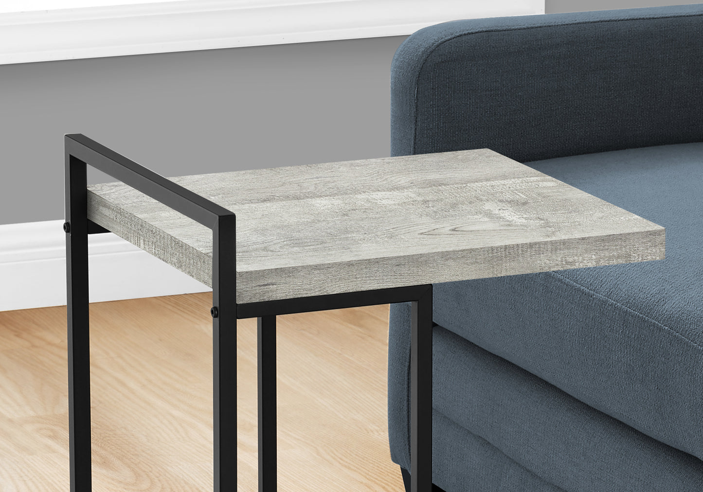 Gray wood grain top C table with black metal frame perfect for small spaces