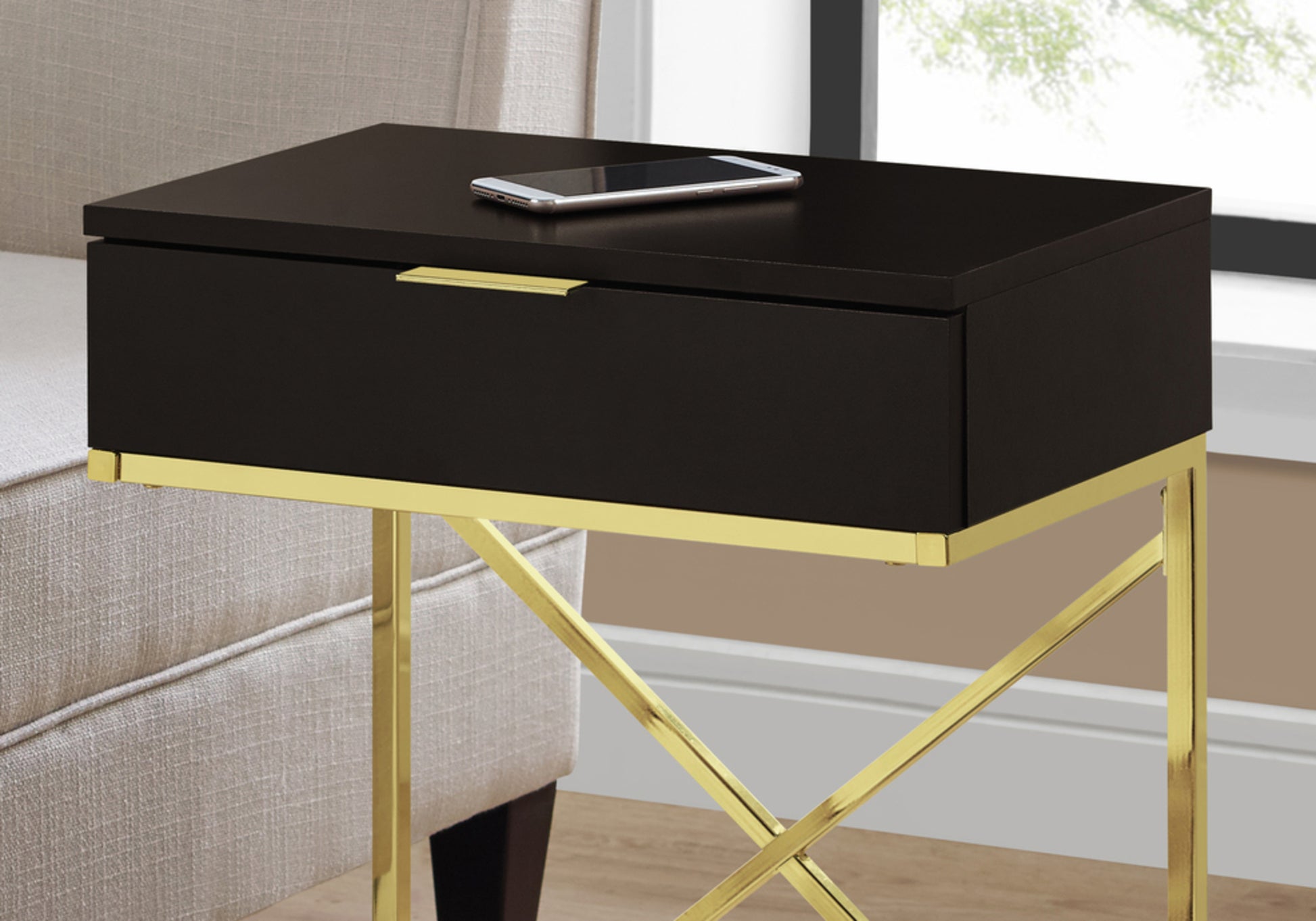 Sleek black end table with gold accents featuring a drawer and modern gold Xframe legs