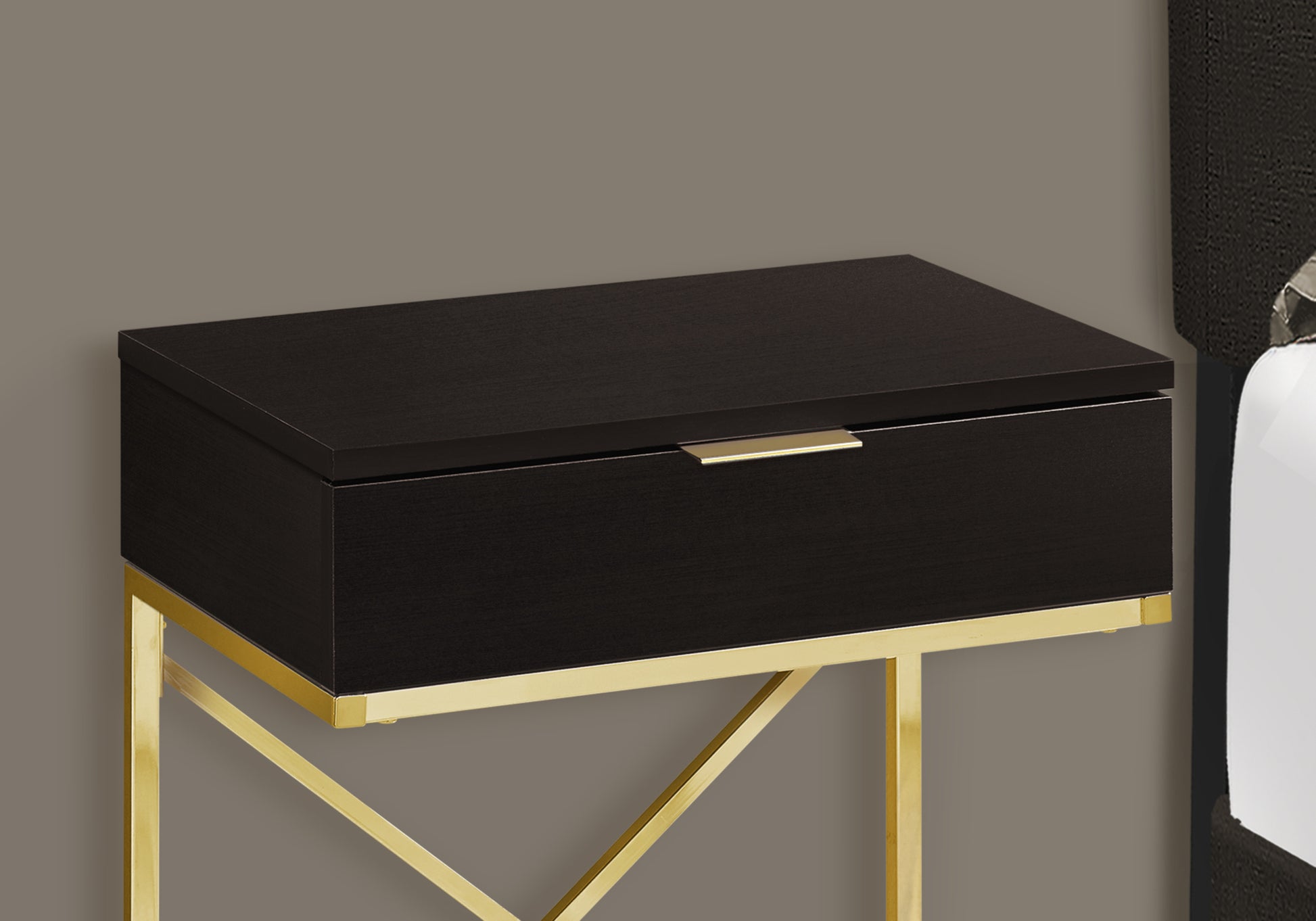 Dark wood bedside table with gold accents and drawer