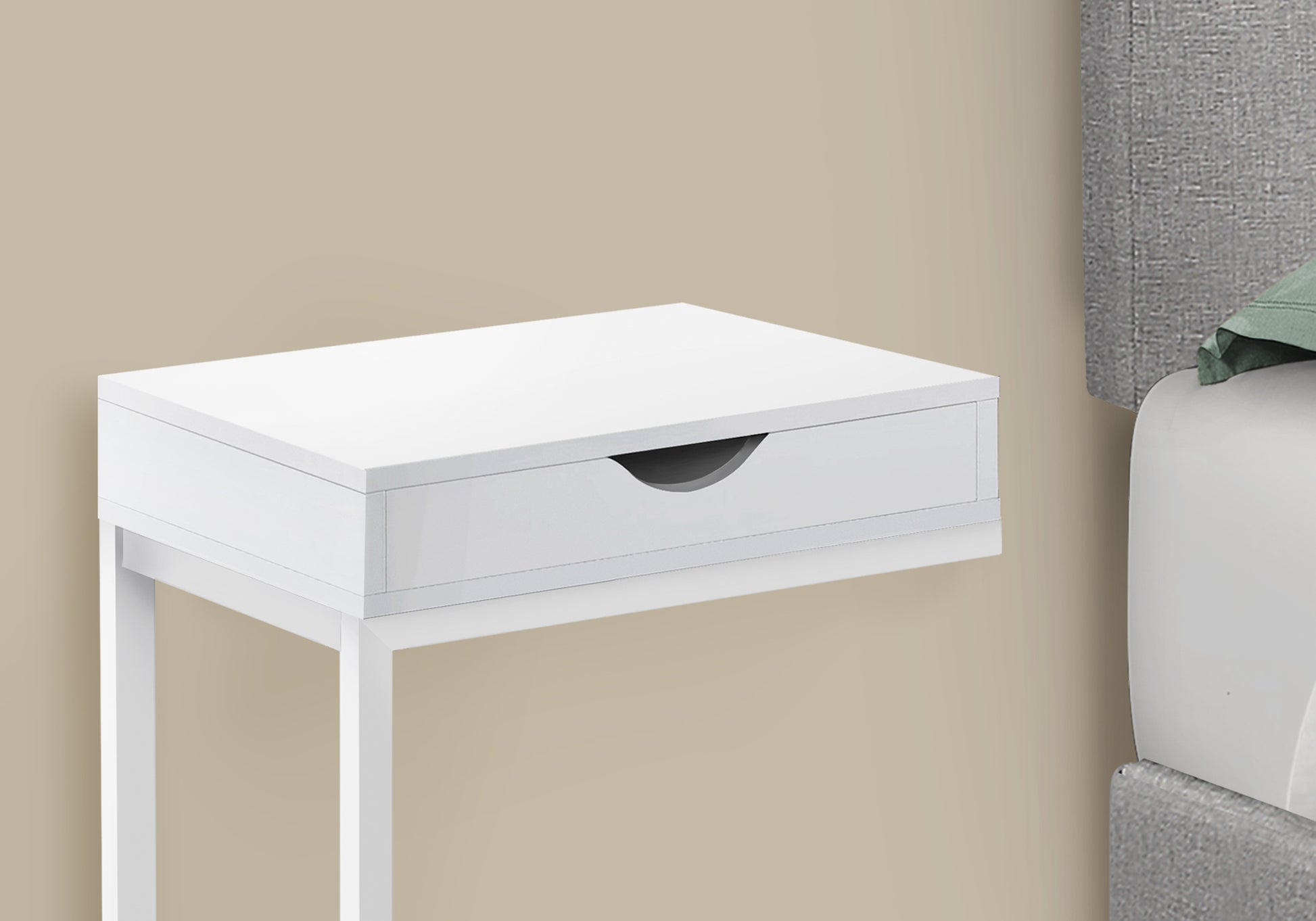 Sleek white bedside table with a single drawer and minimalist design