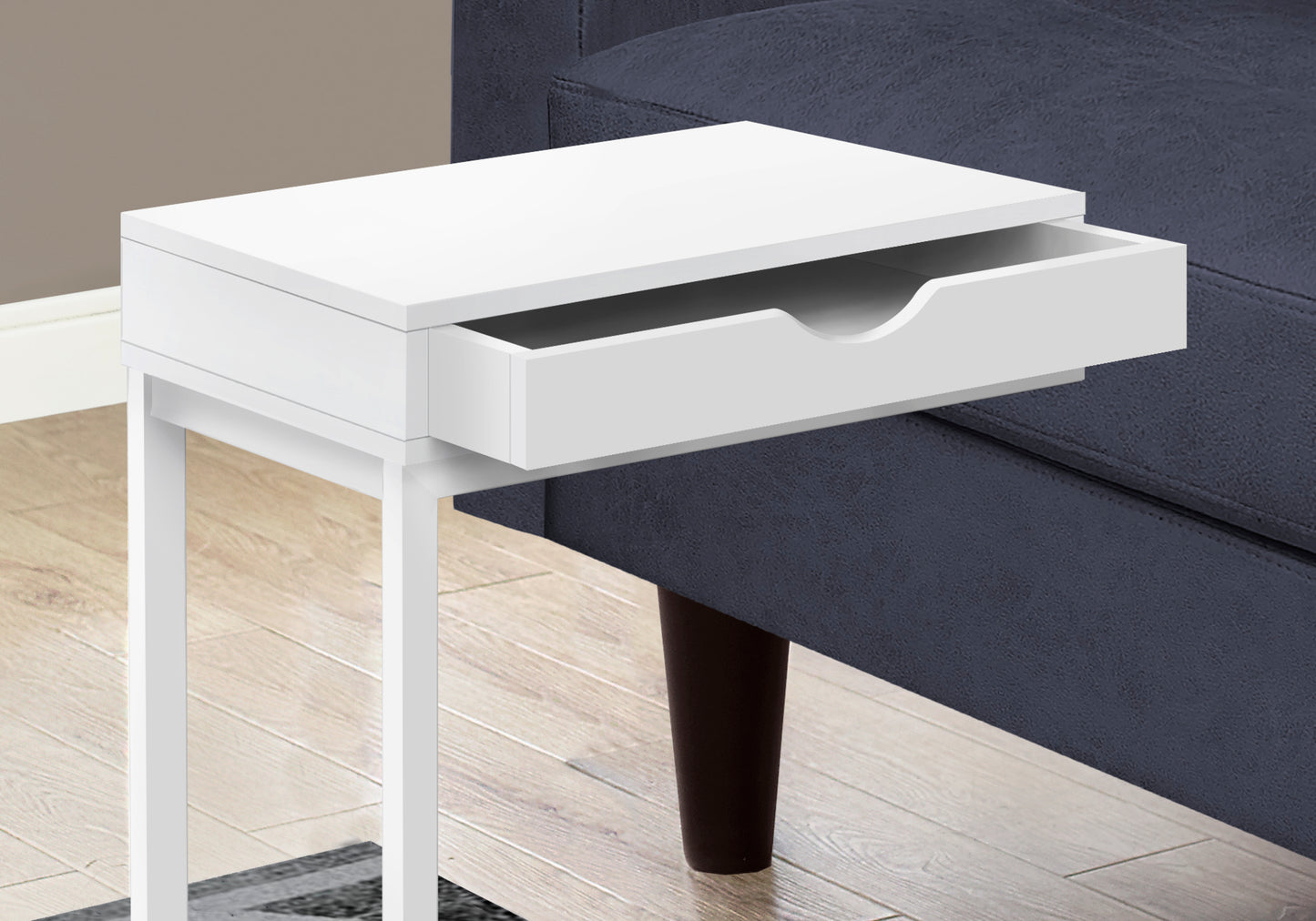 White bedside table with cshaped base and open drawer ideal for small spaces