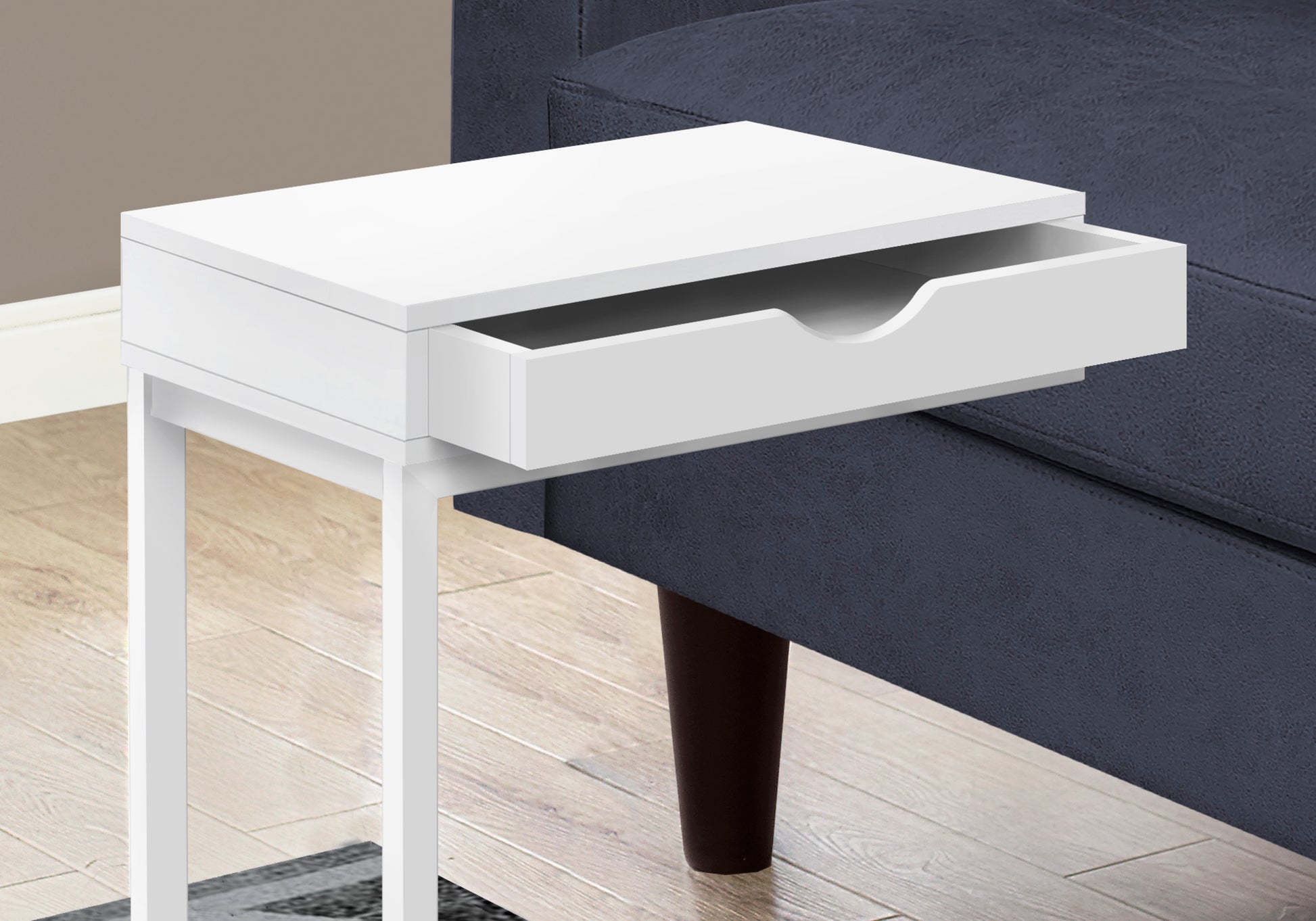 White bedside table with cshaped base and open drawer ideal for small spaces