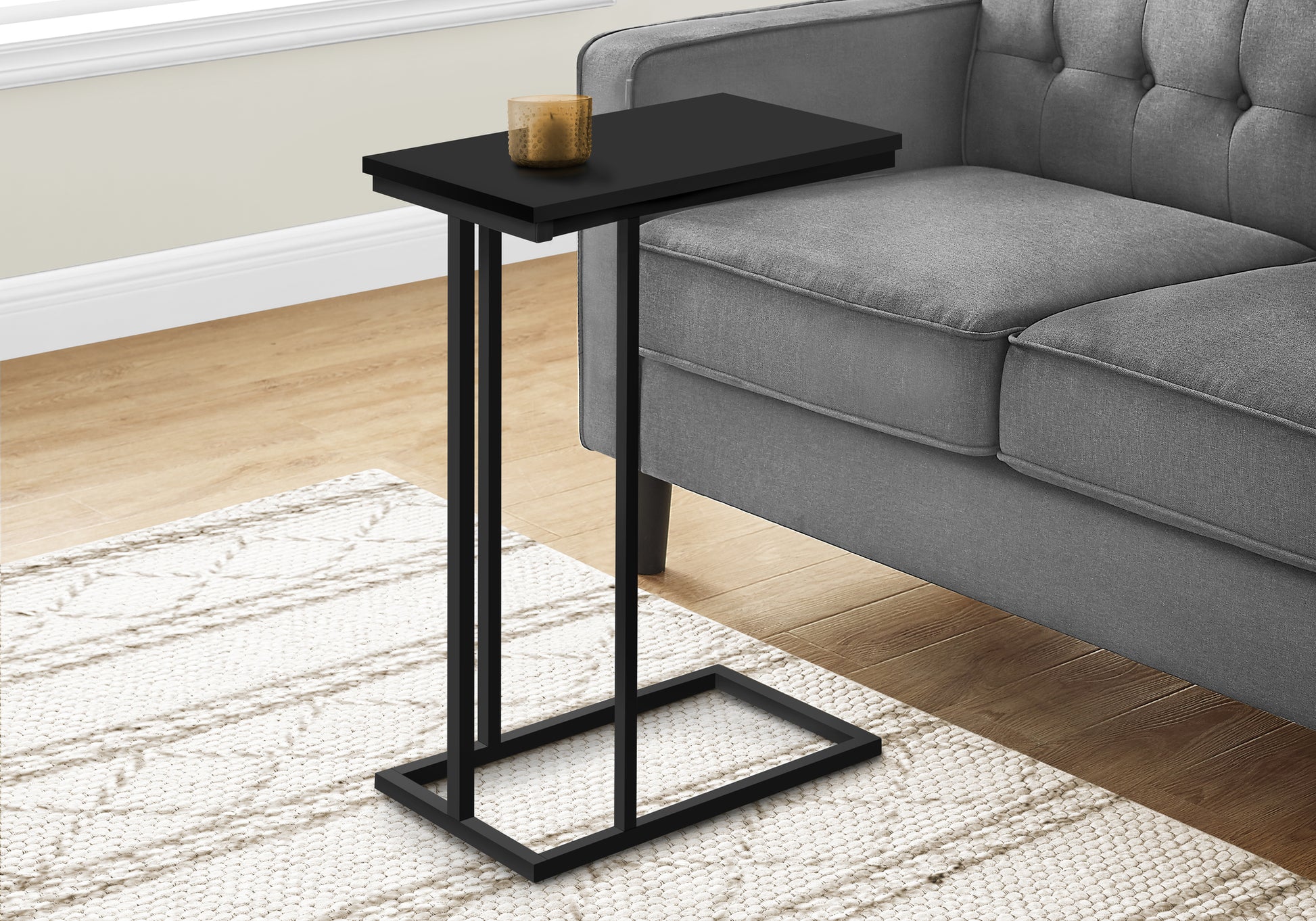 Black Ctable with slim metal legs perfect for next to a sofa