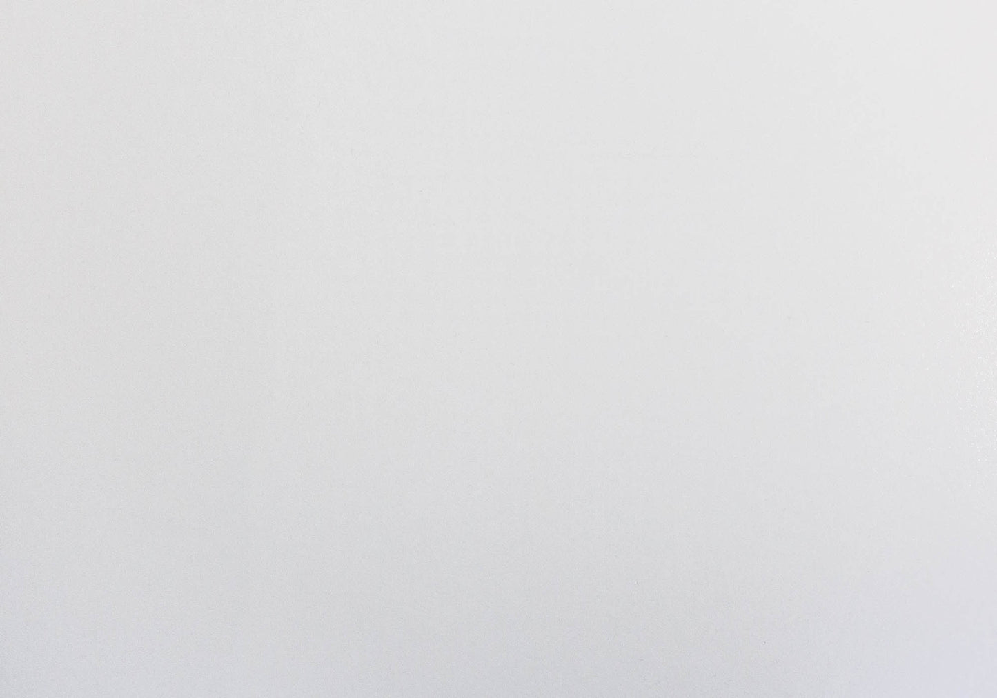 Flat lay of a crisp white linen tablecloth perfect for a minimalist dining setting