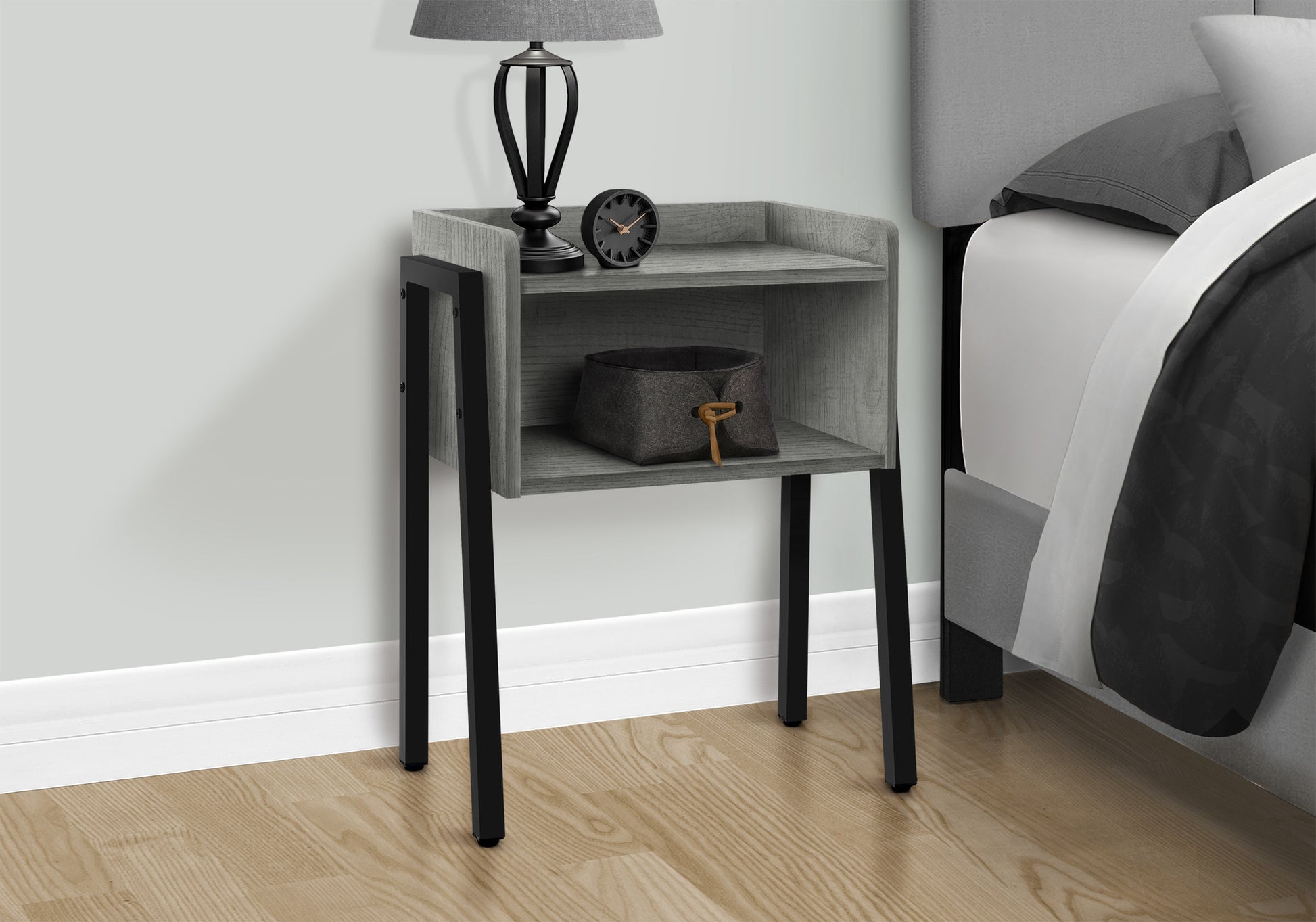 Modern gray wood nightstand with black metal legs and a storage basket
