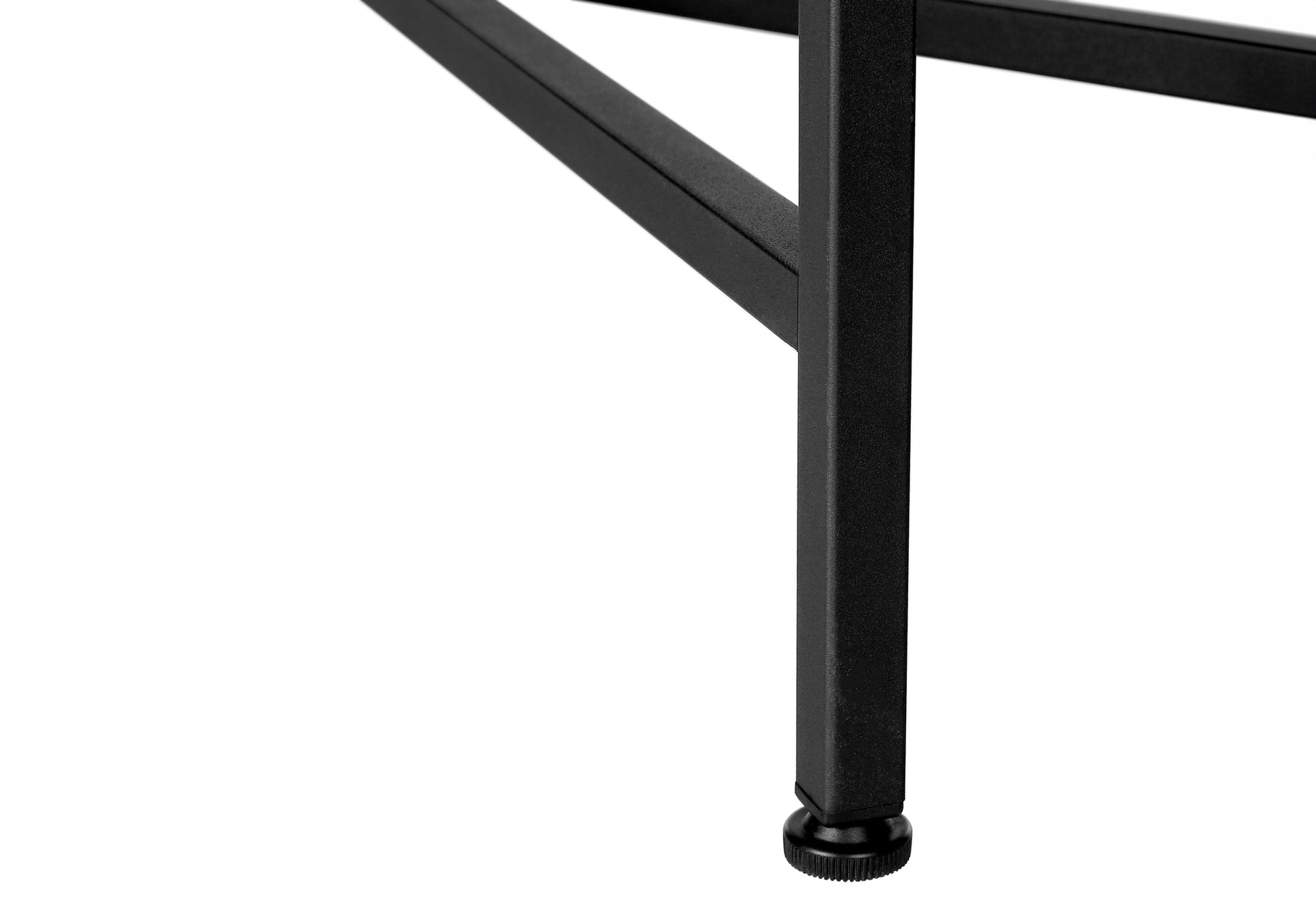 Closeup of black metal table leg with adjustable foot on white background