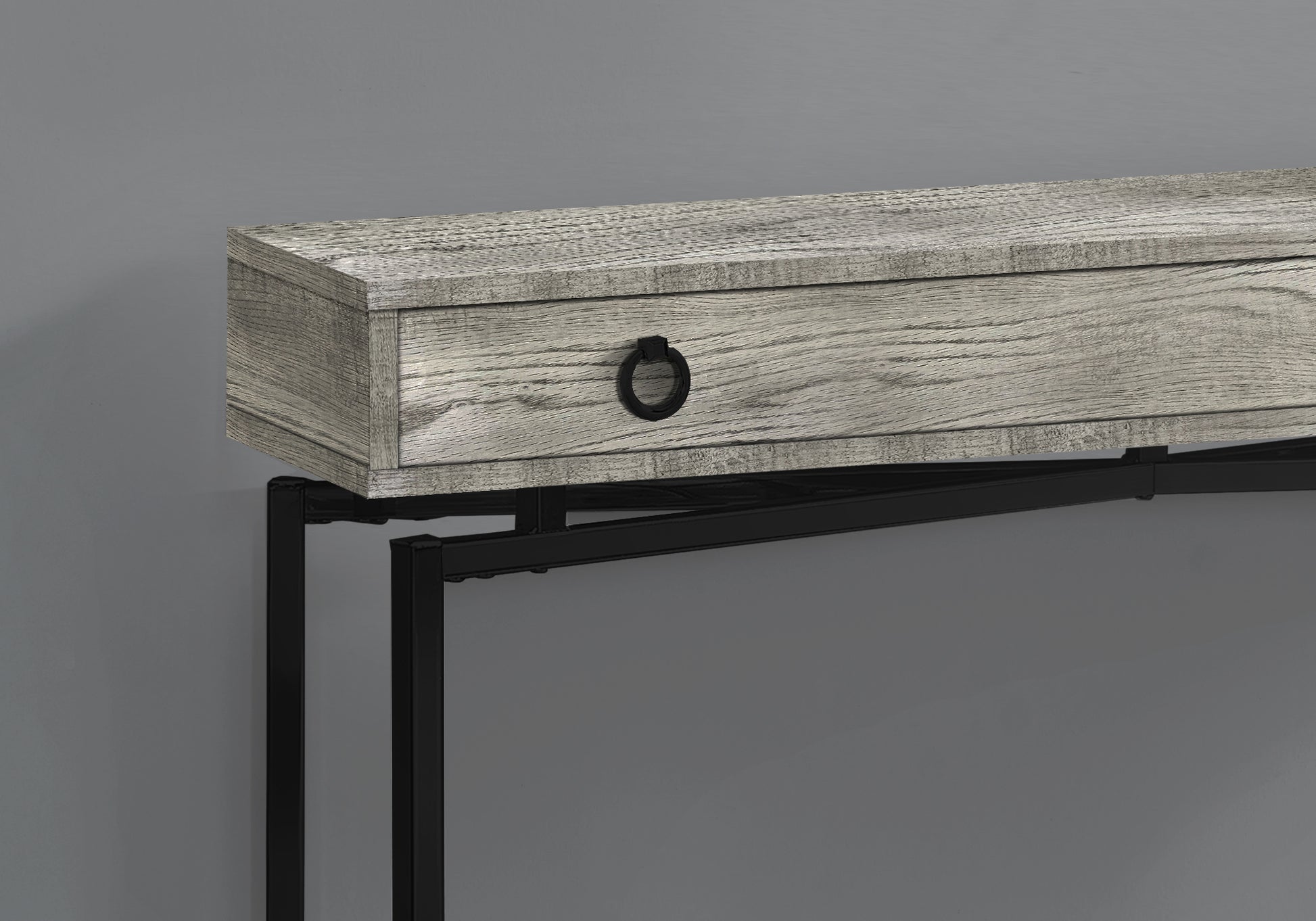 Gray wash wood console table with black metal frame and ring pull drawer