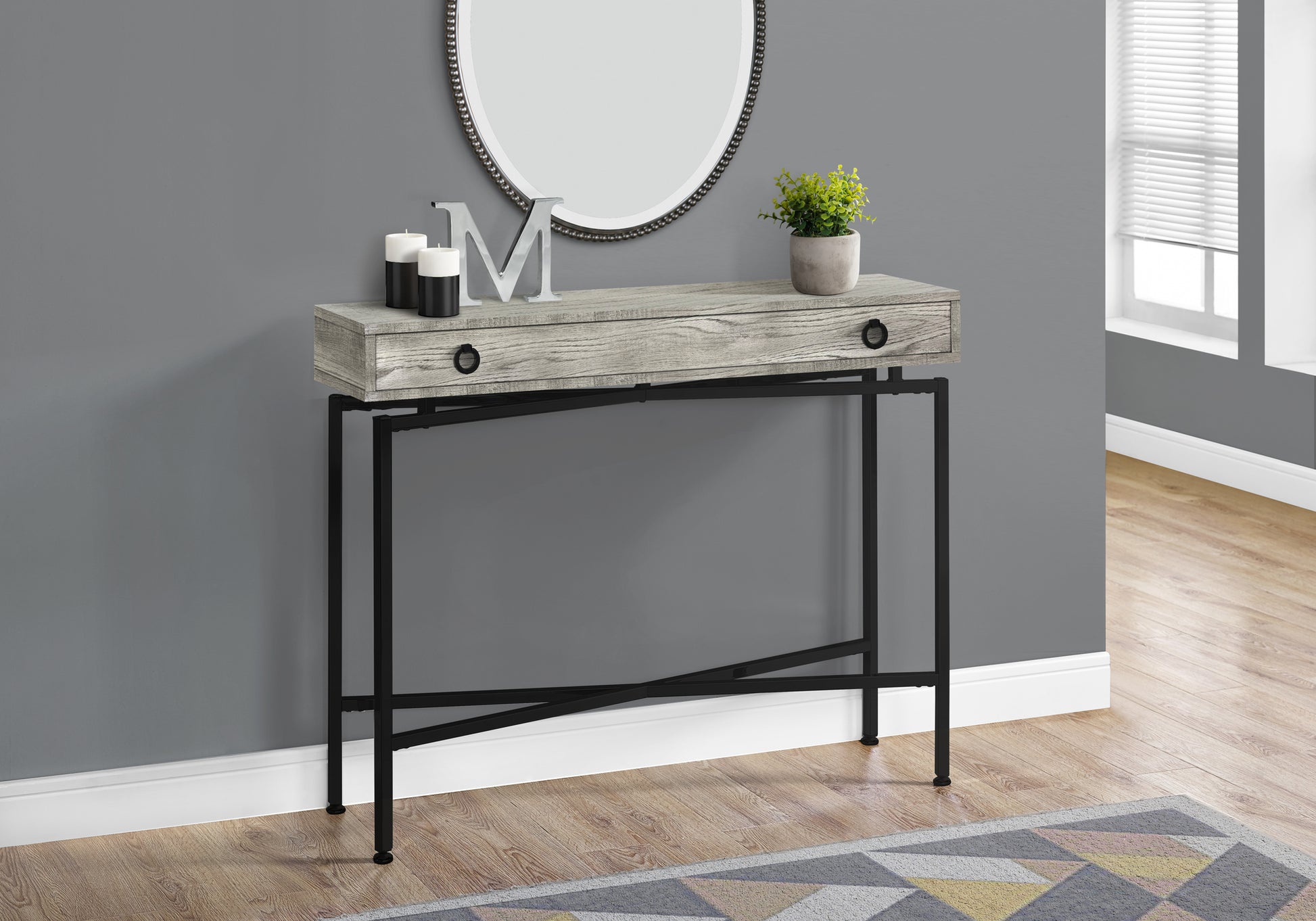 Gray wood grain console table with black metal frame and single drawer