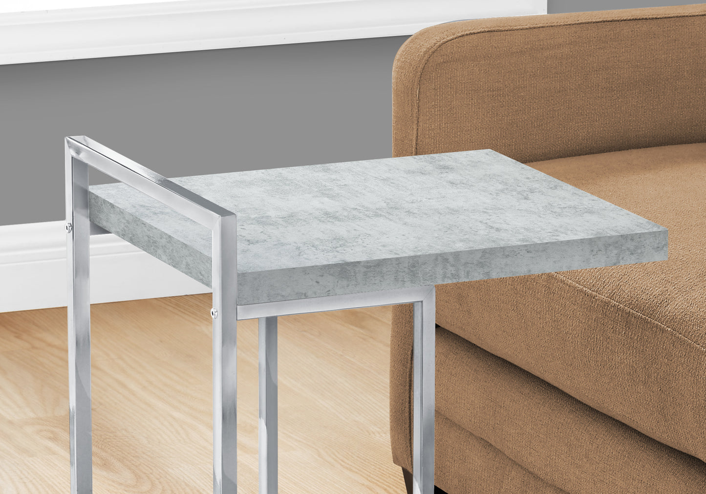 Modern Ctable with textured gray concrete top and sleek chrome metal frame