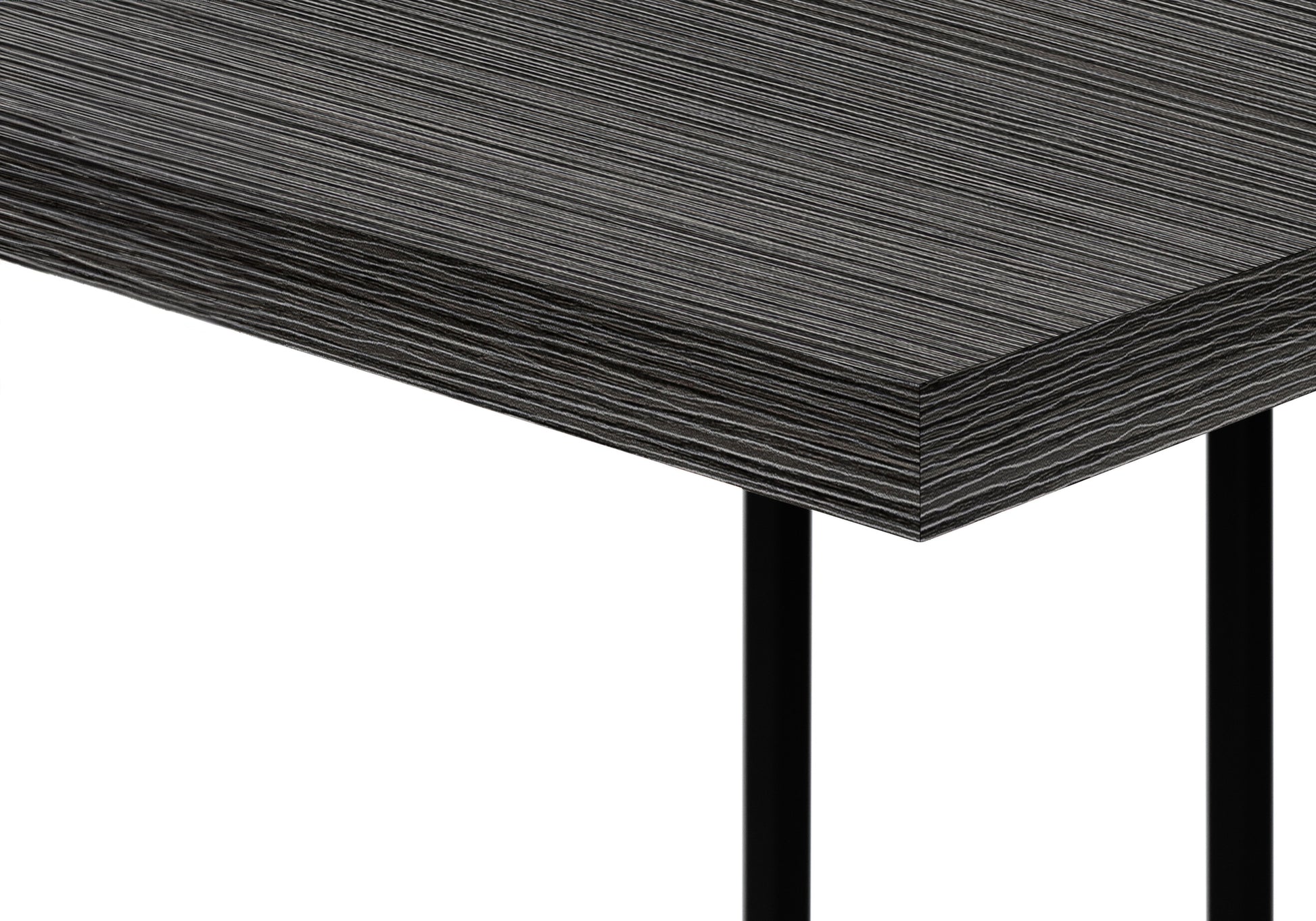 Closeup of a modern dark wood laminate desk surface with a subtle linear grain pattern