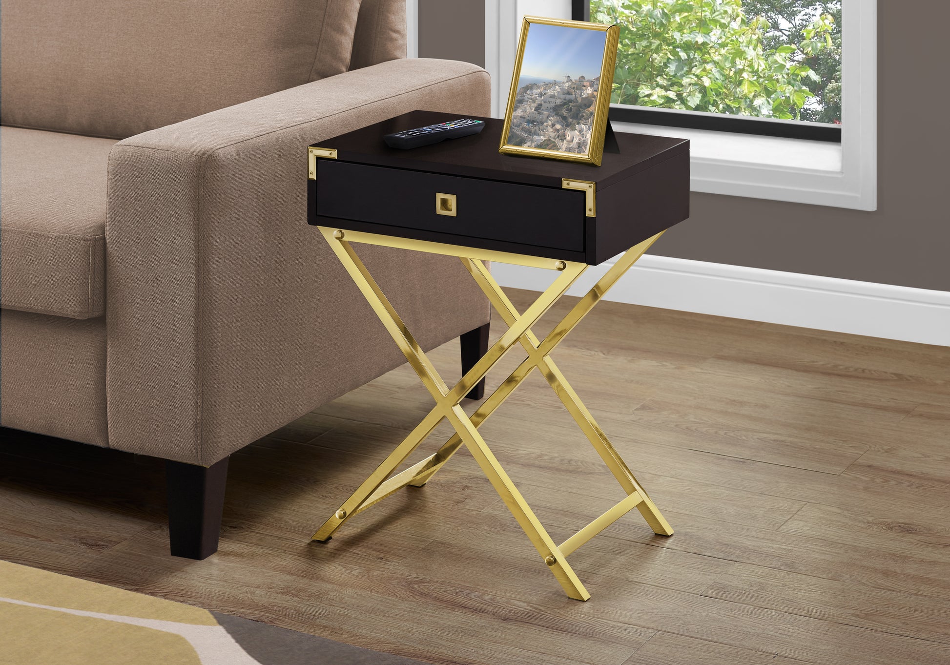 Dark wood accent table with gold Xbase featuring a single drawer and brass hardware