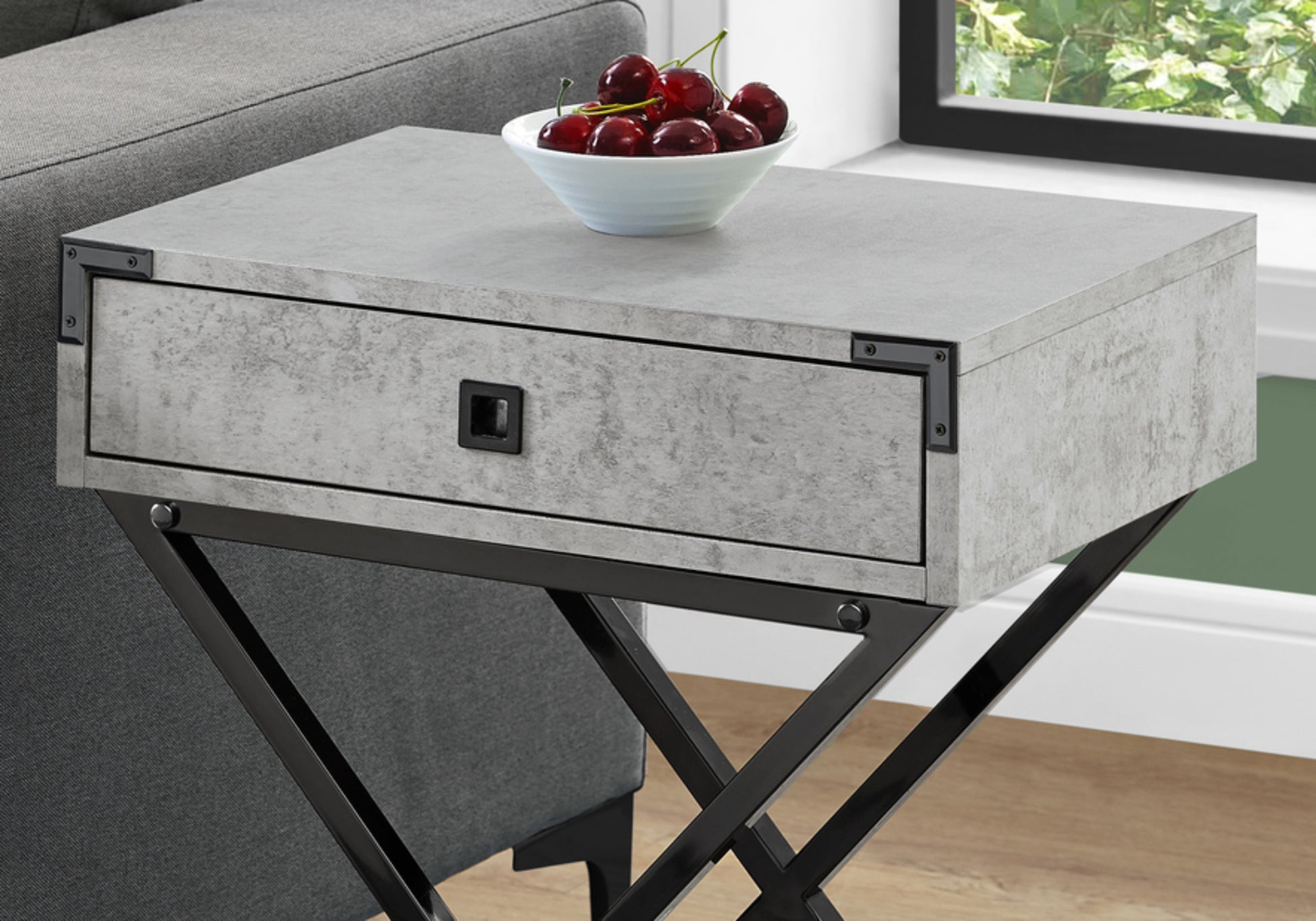 Concretelook end table with black metal Xframe legs and a single drawer