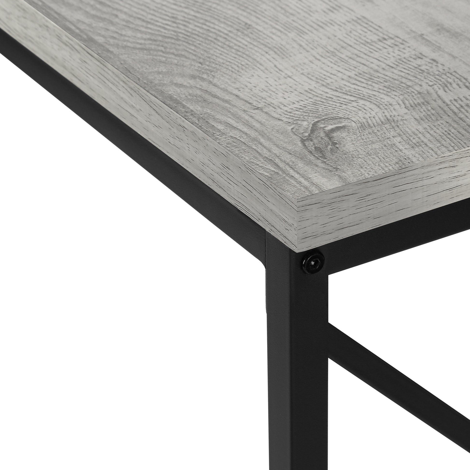 Closeup of a rustic grey woodgrain desktop with black metal frame support for a modern desk