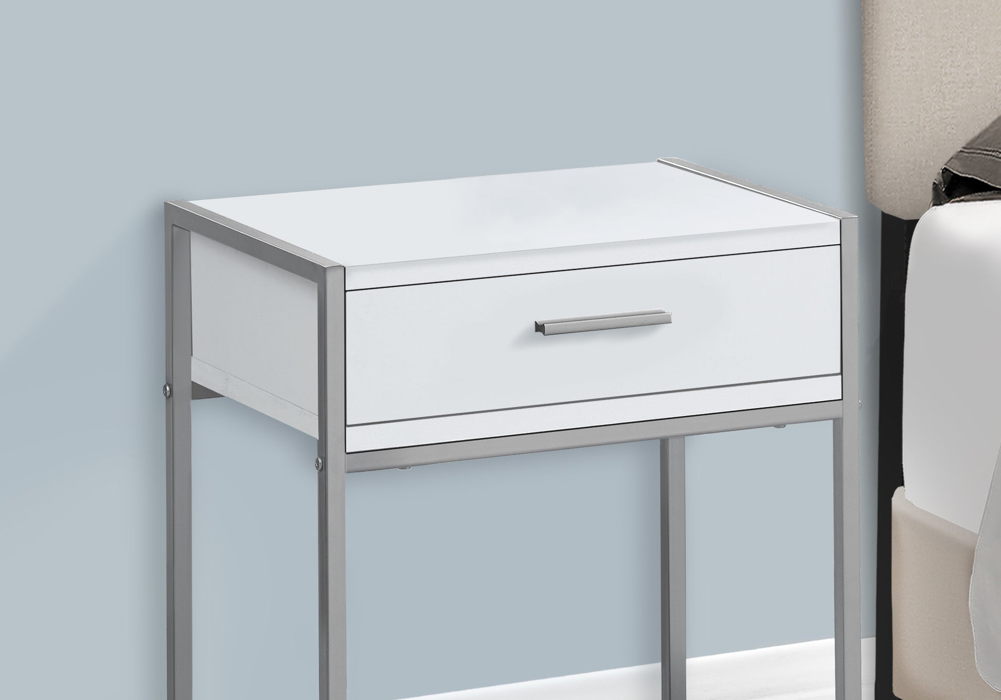 Modern white nightstand with a single drawer and silver metal frame perfect for bedrooms