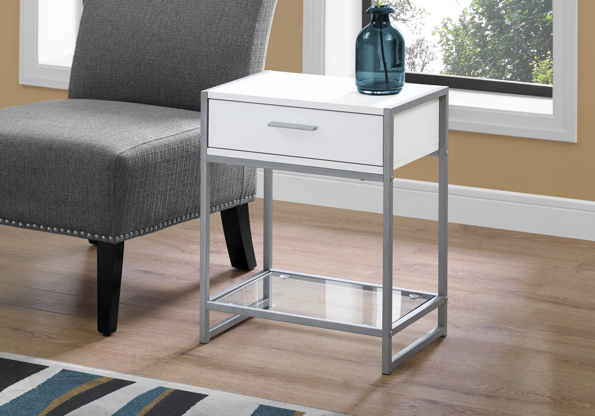 White and silver metal frame accent table with one drawer and glass shelf