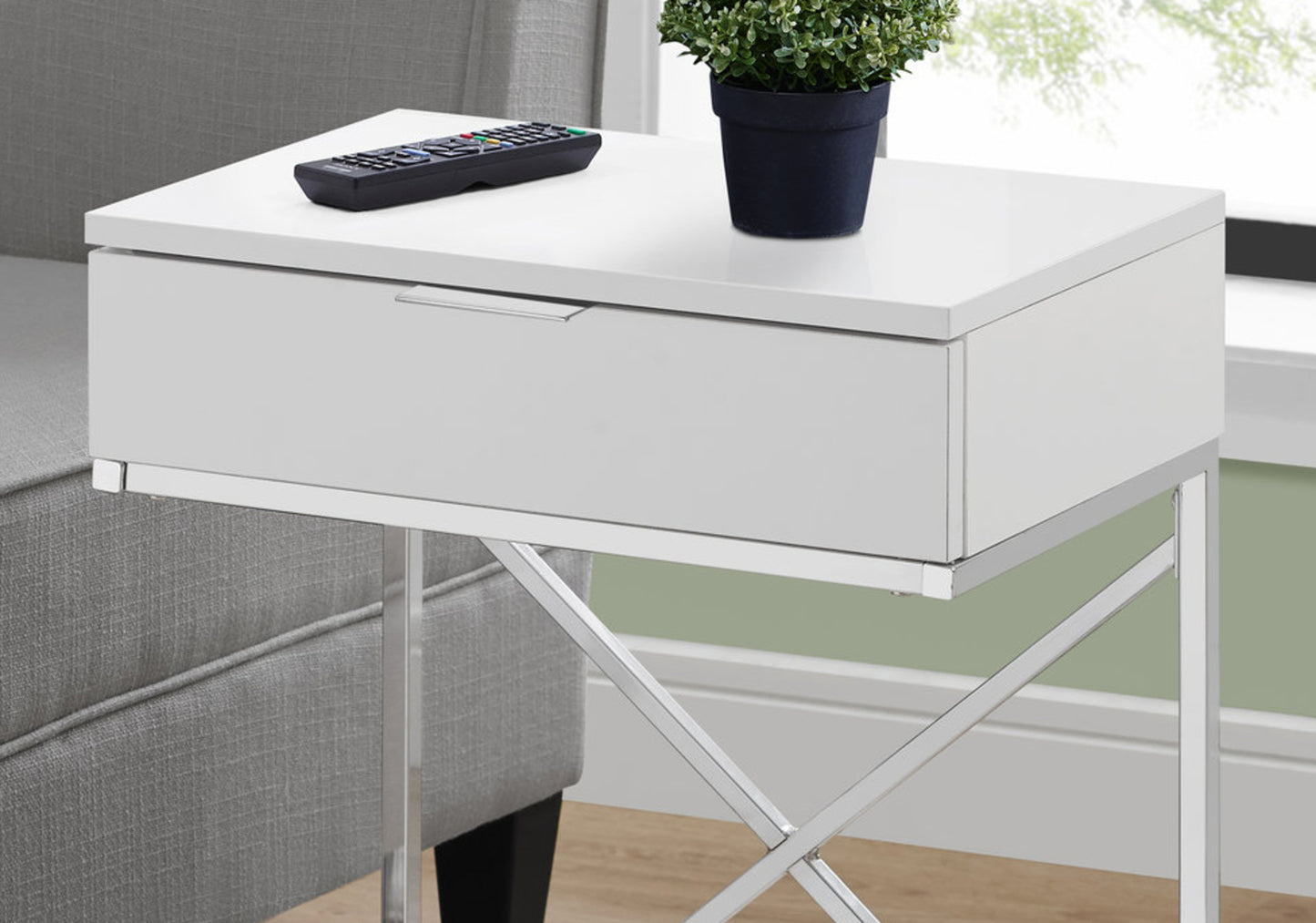 Sleek white end table with a single drawer and chrome Xframe legs