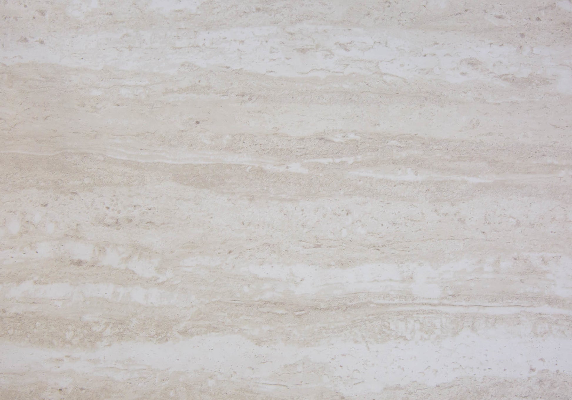 Closeup of light beige travertine tile with natural horizontal veining