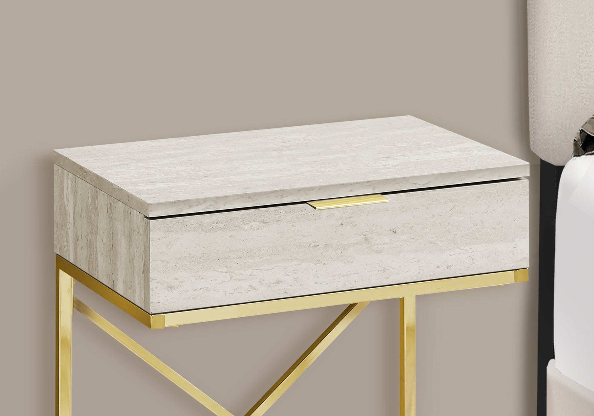 Travertine nightstand with a modern gold frame and brass drawer pull