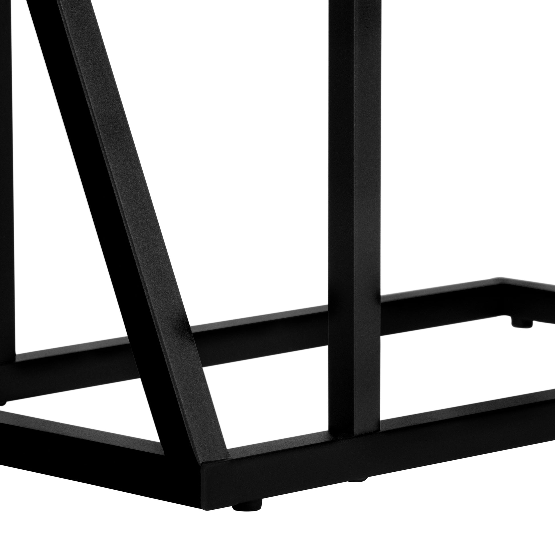 Closeup of a black metal table leg with a modern geometric design