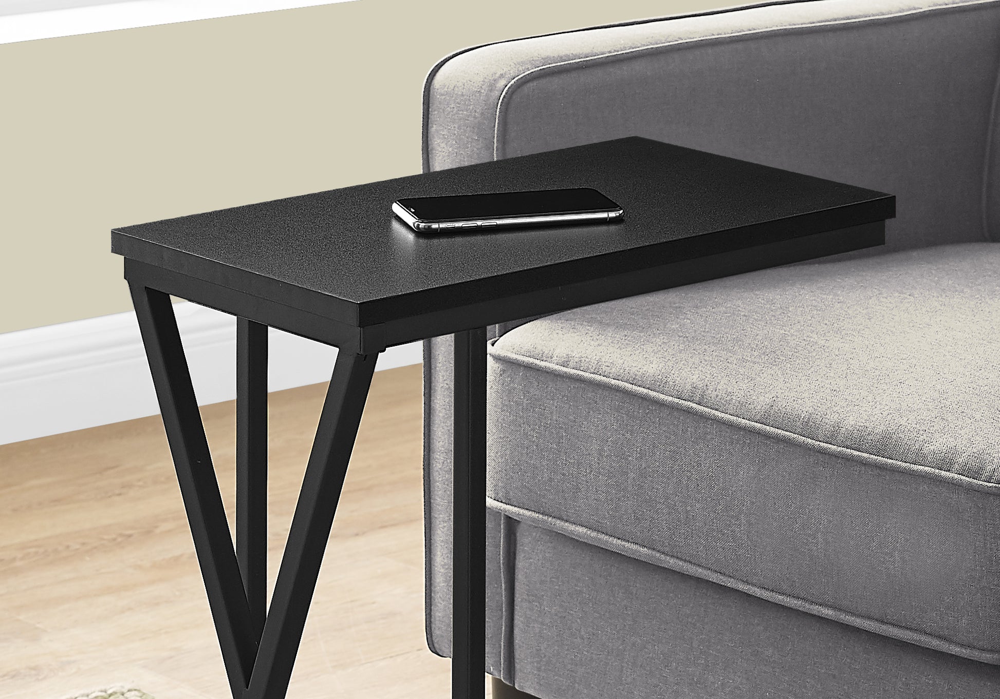Black metal ctable with textured top perfect for small spaces