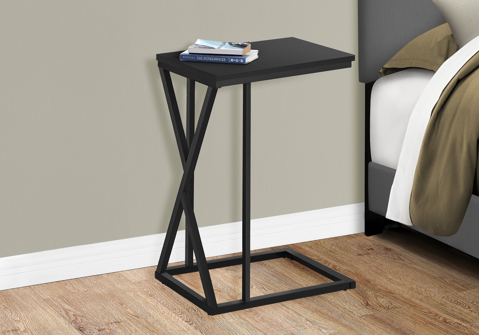 Black metal Ctable with contemporary twisted base perfect for small spaces
