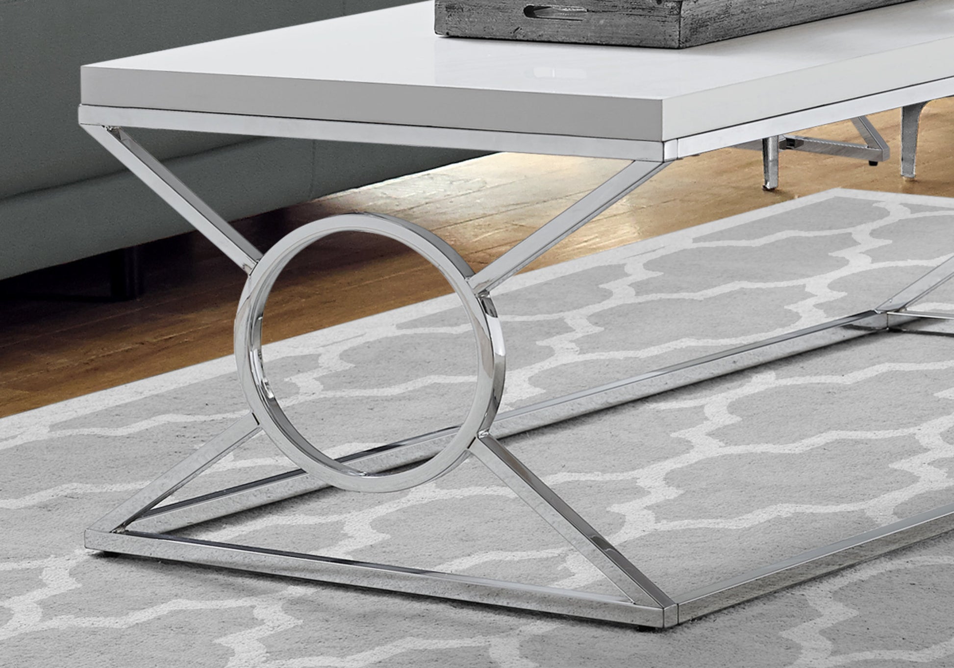 White highgloss coffee table with chrome circular leg design for modern living rooms