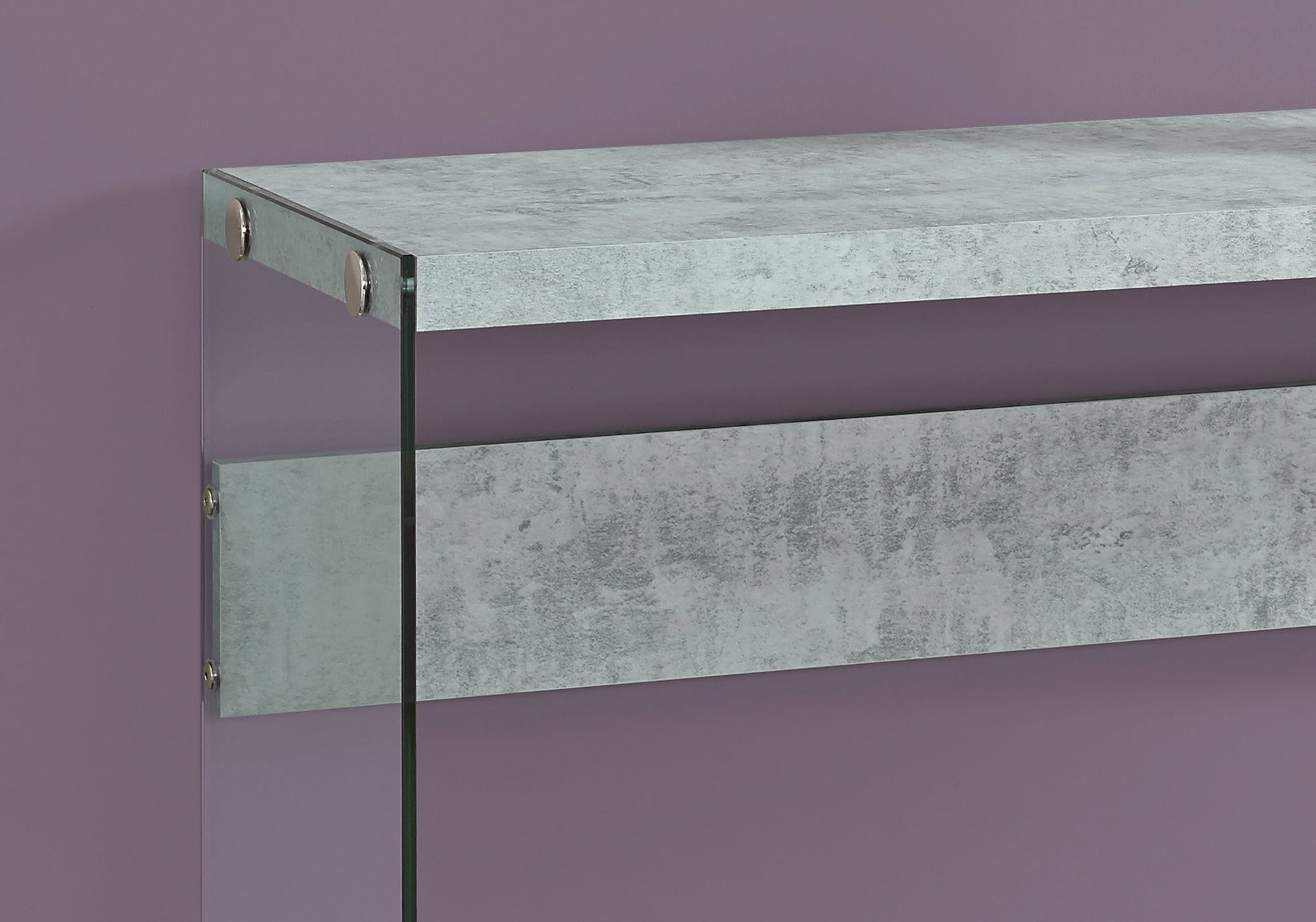 Modern console table with distressed concrete finish and glass legs