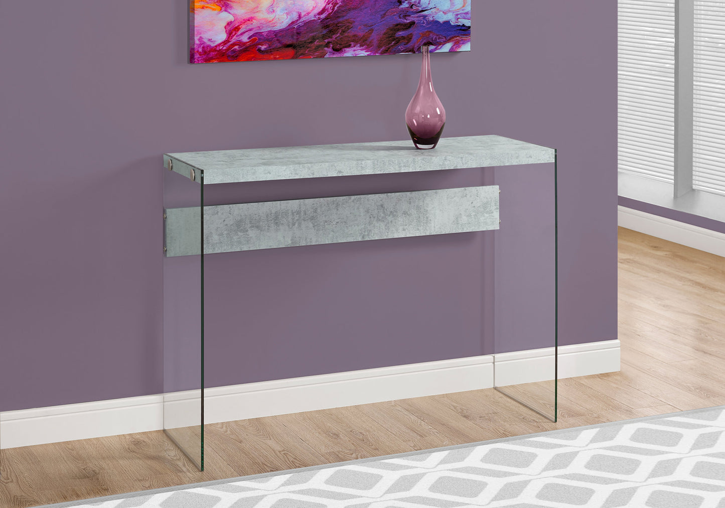 Modern glass console table with a grey concretelook top and shelf