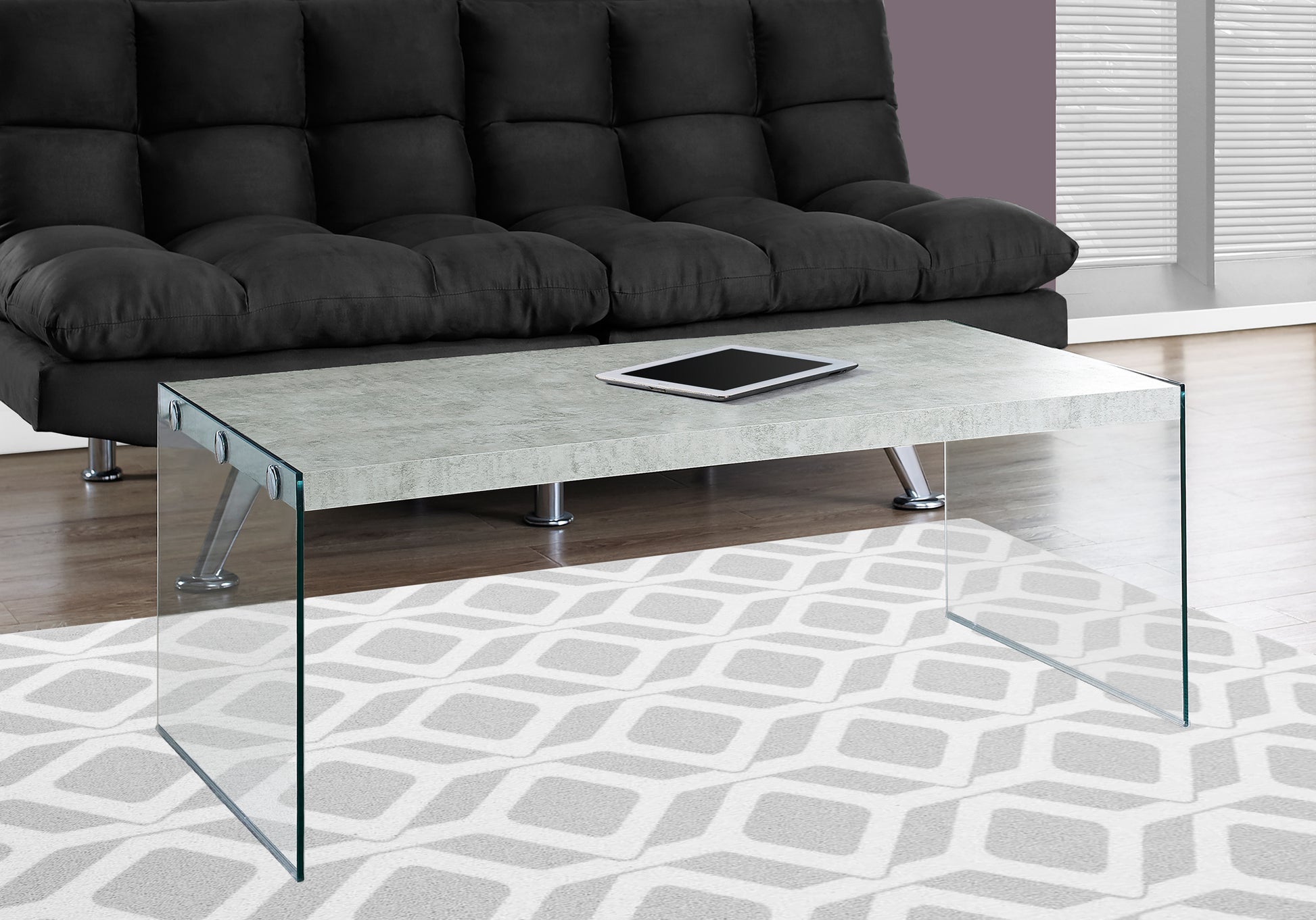 Modern grey concrete top coffee table with clear glass legs