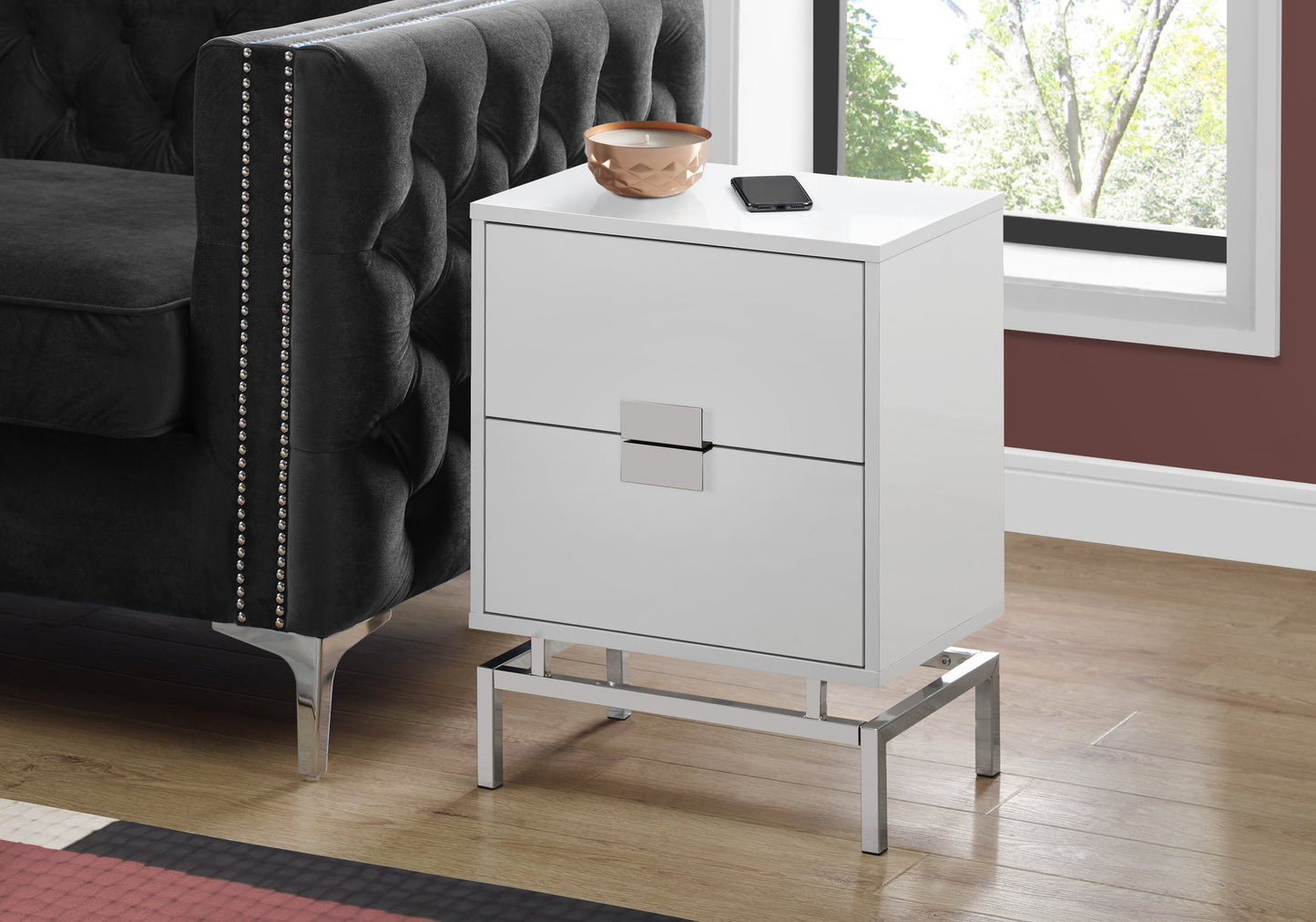 Sleek white twodrawer nightstand with chrome legs and drawer pulls perfect for modern bedrooms