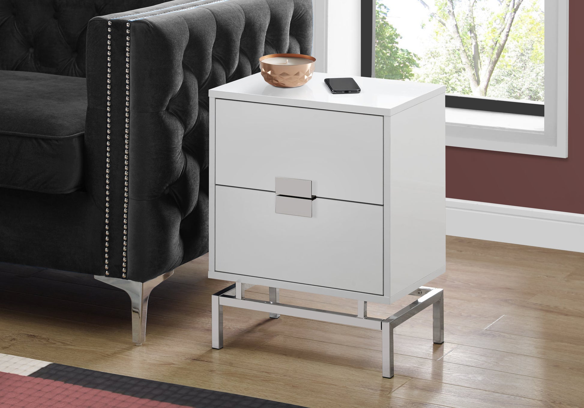 Sleek white twodrawer nightstand with chrome legs and drawer pulls perfect for modern bedrooms