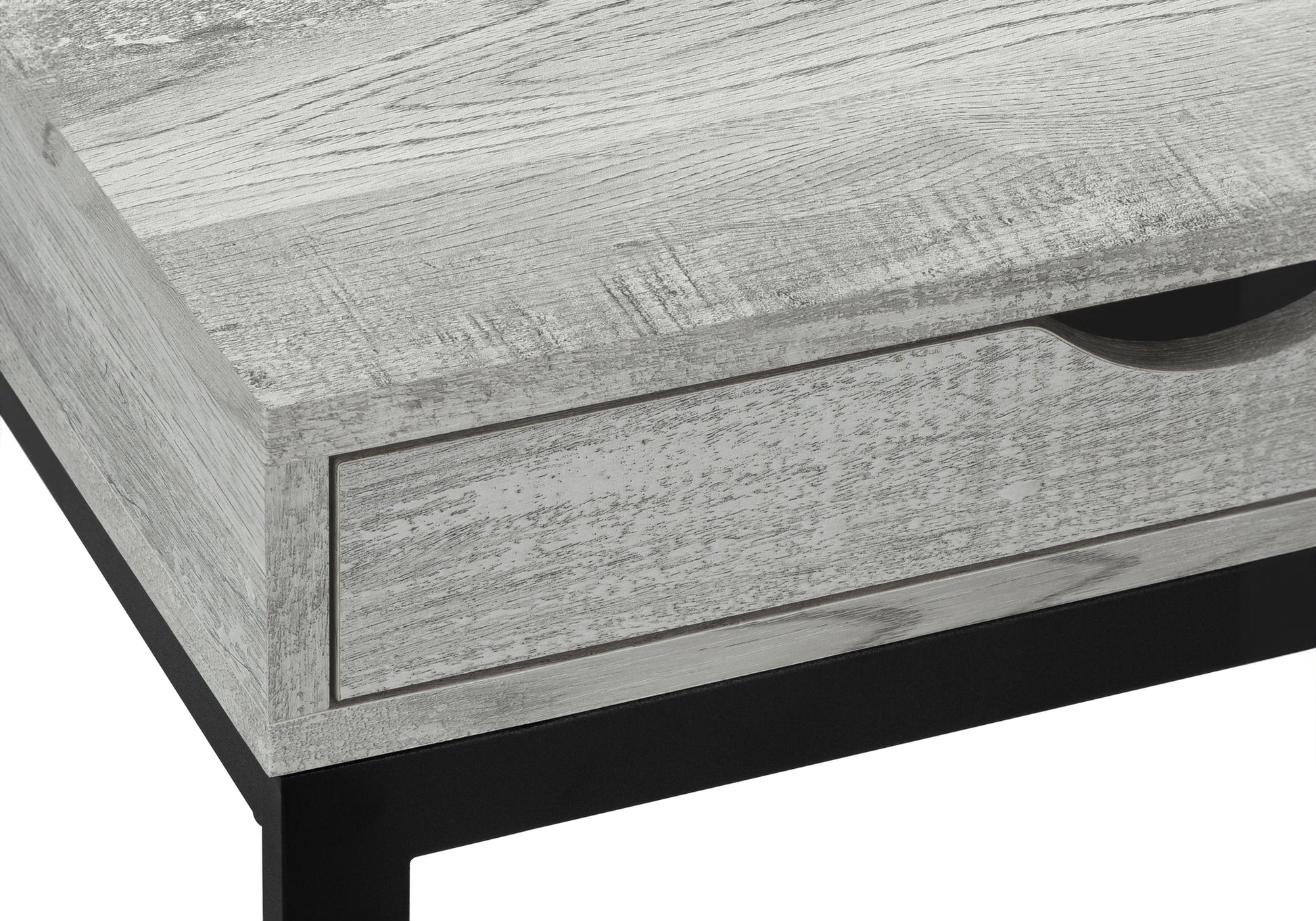 Distressed wood grain texture on a gray coffee table with a black metal frame and drawer