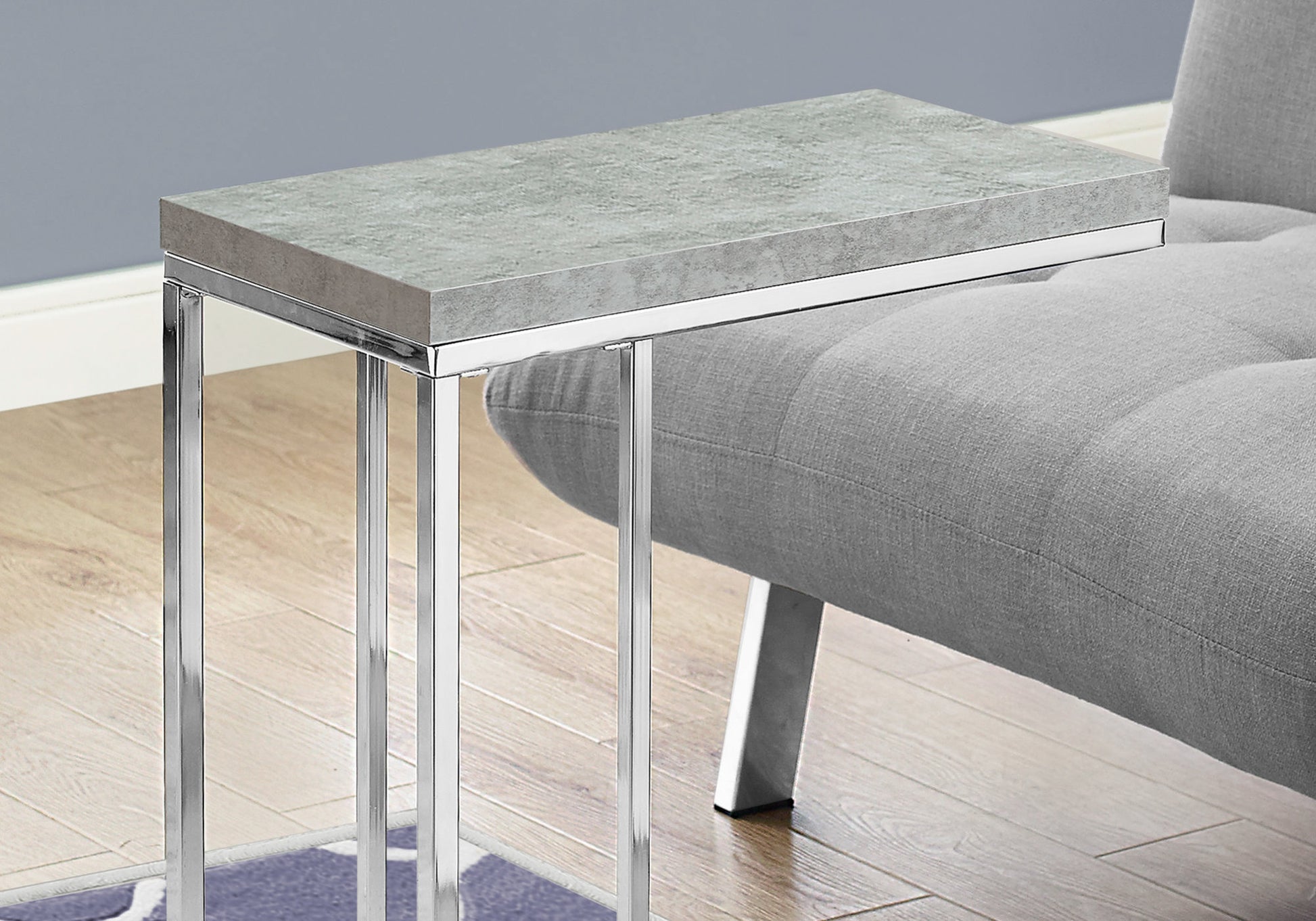 Gray Ctable with faux marble top and chrome legs perfect for sofa side