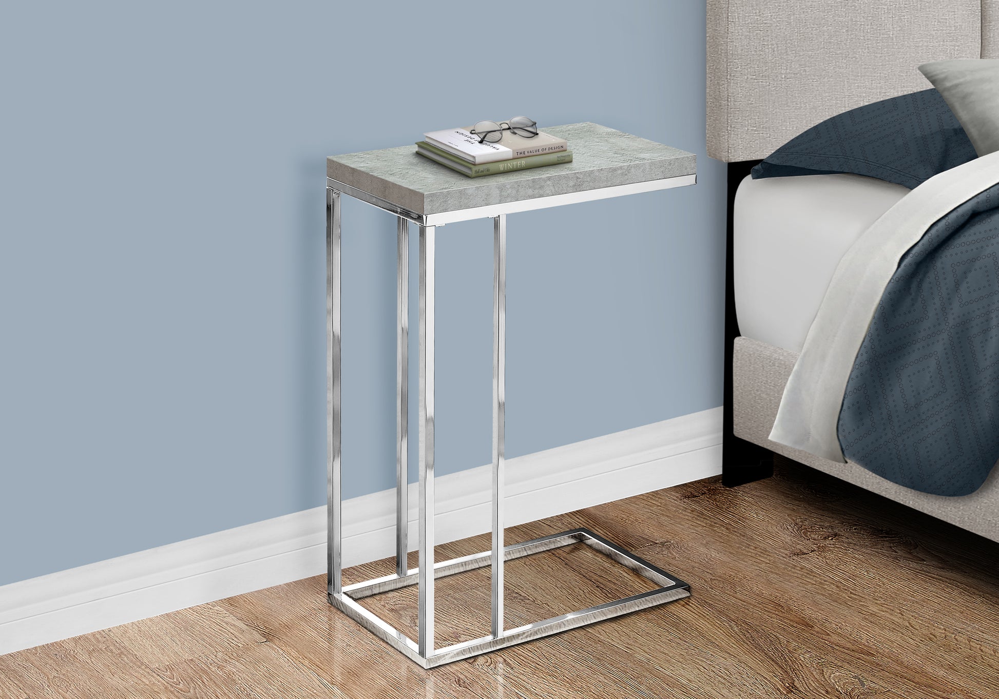 Modern ctable with textured gray top and polished chrome frame perfect for a living room