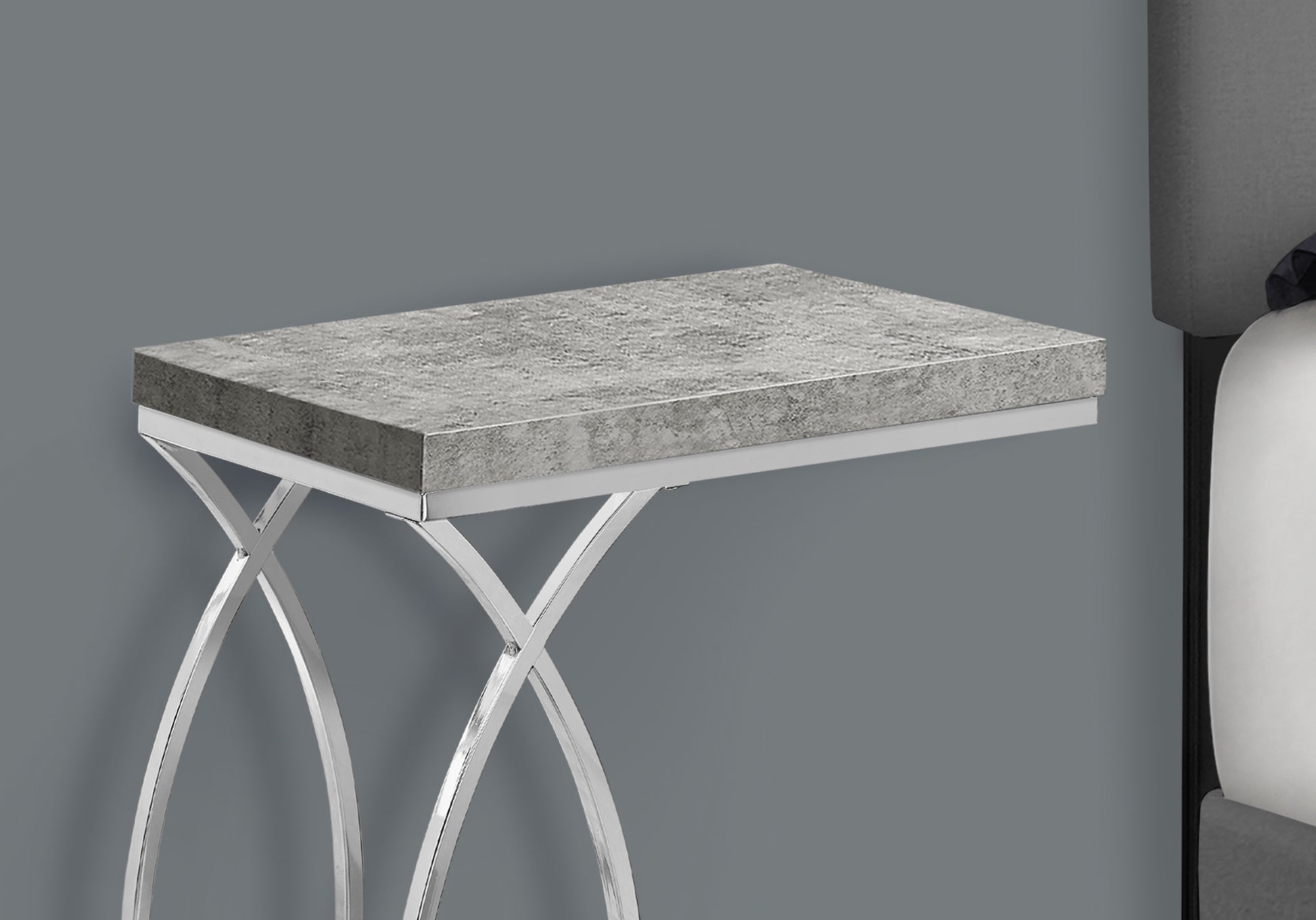 Gray concrete top accent table with chrome legs and curved base