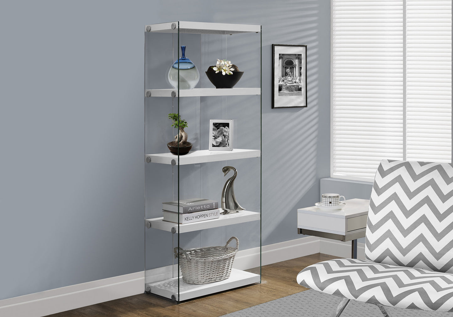 Tall narrow display cabinet with white shelves and clear glass sides showcasing decor items
