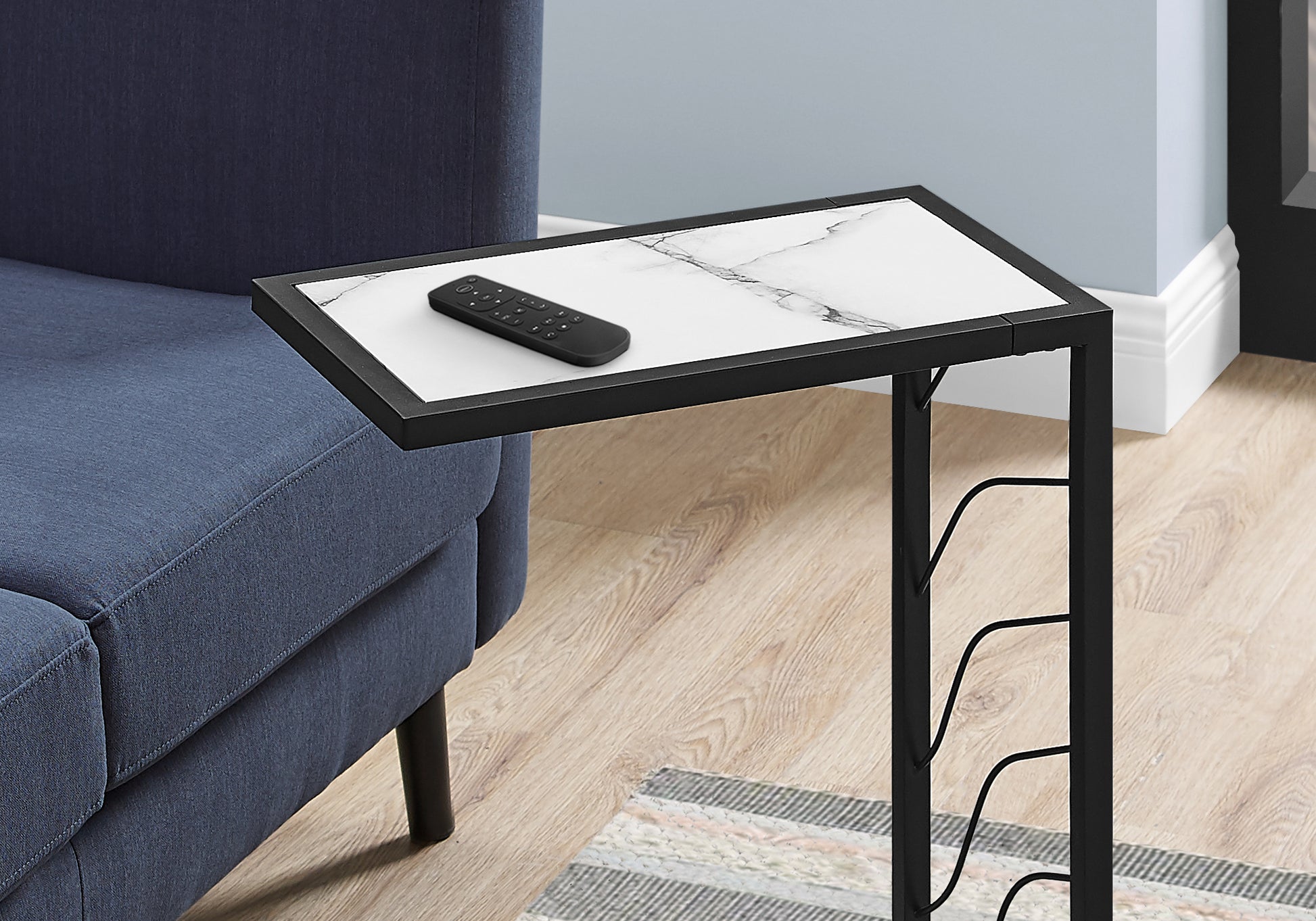 Black Ctable with white marble top and remote perfect for living room convenience
