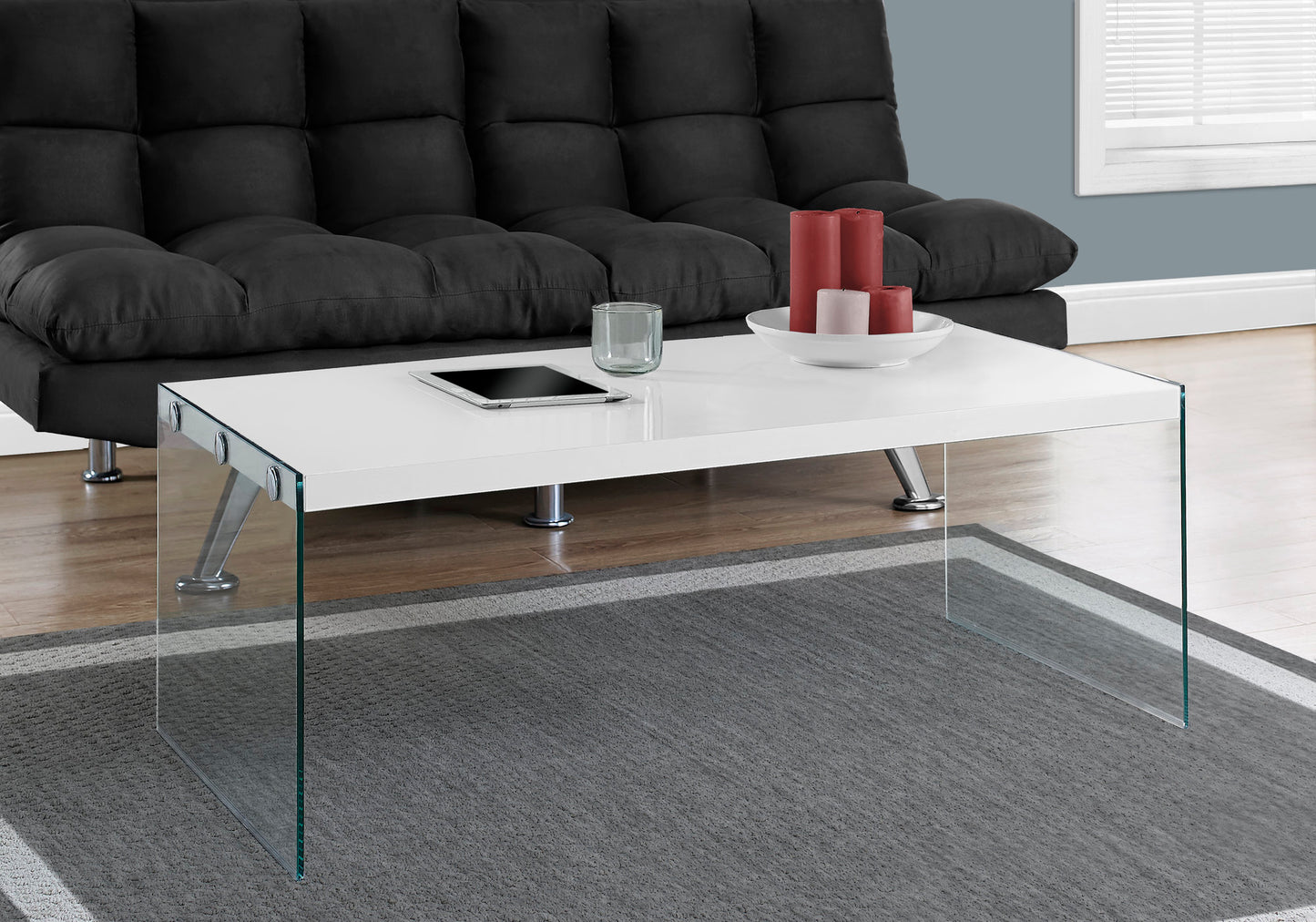 White rectangular coffee table with glass legs and modern chrome accents
